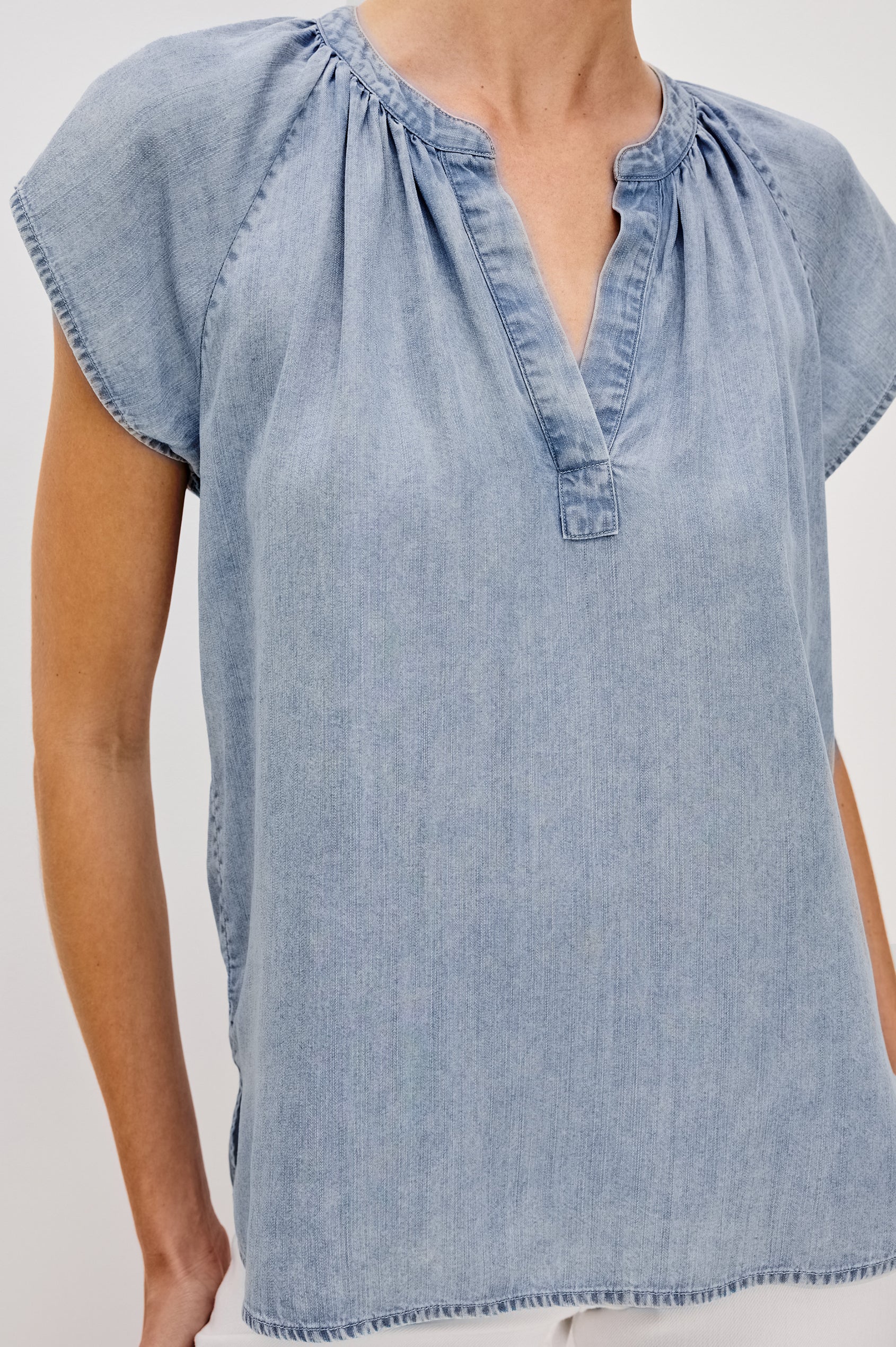 Maribel V-Front Top with Short Raglan Sleeves in Medium Cloud Wash. Front Detail View Shown on Model. 