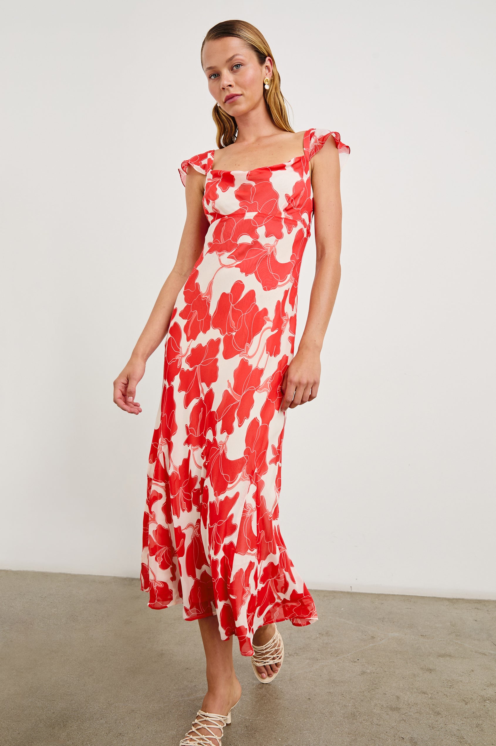 Marigold Midi Dress with Cap Ruffled Sleeves and a Scoop Neckline in Scarlet Hibiscus Colorway on white - Front Full Body View Featured on Model