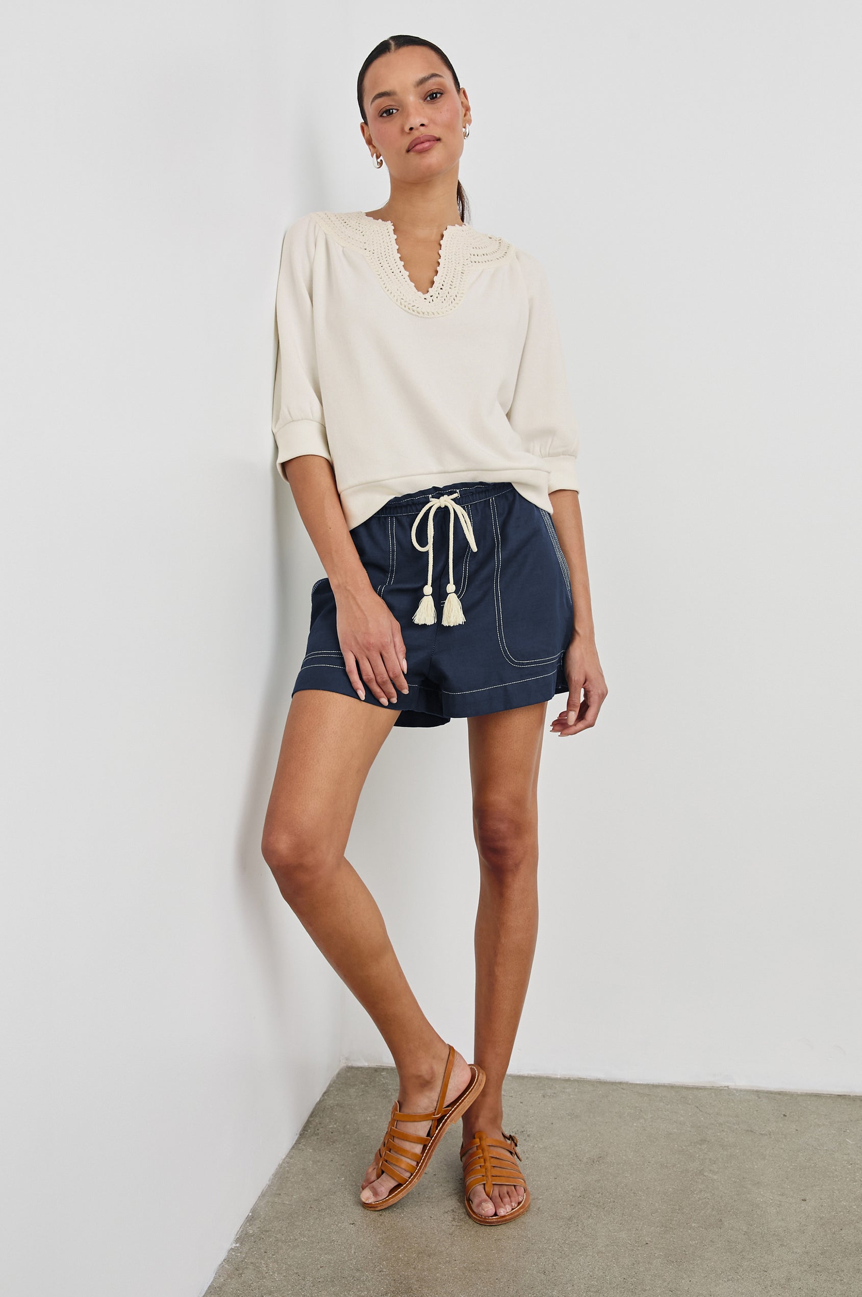 Mariposa Relaxed Fit Top with Elbow Length Sleeves, Tonal Embroidery Details Along Split Neckline in Ivory Colorway. Full Length Front View Shown on Model.