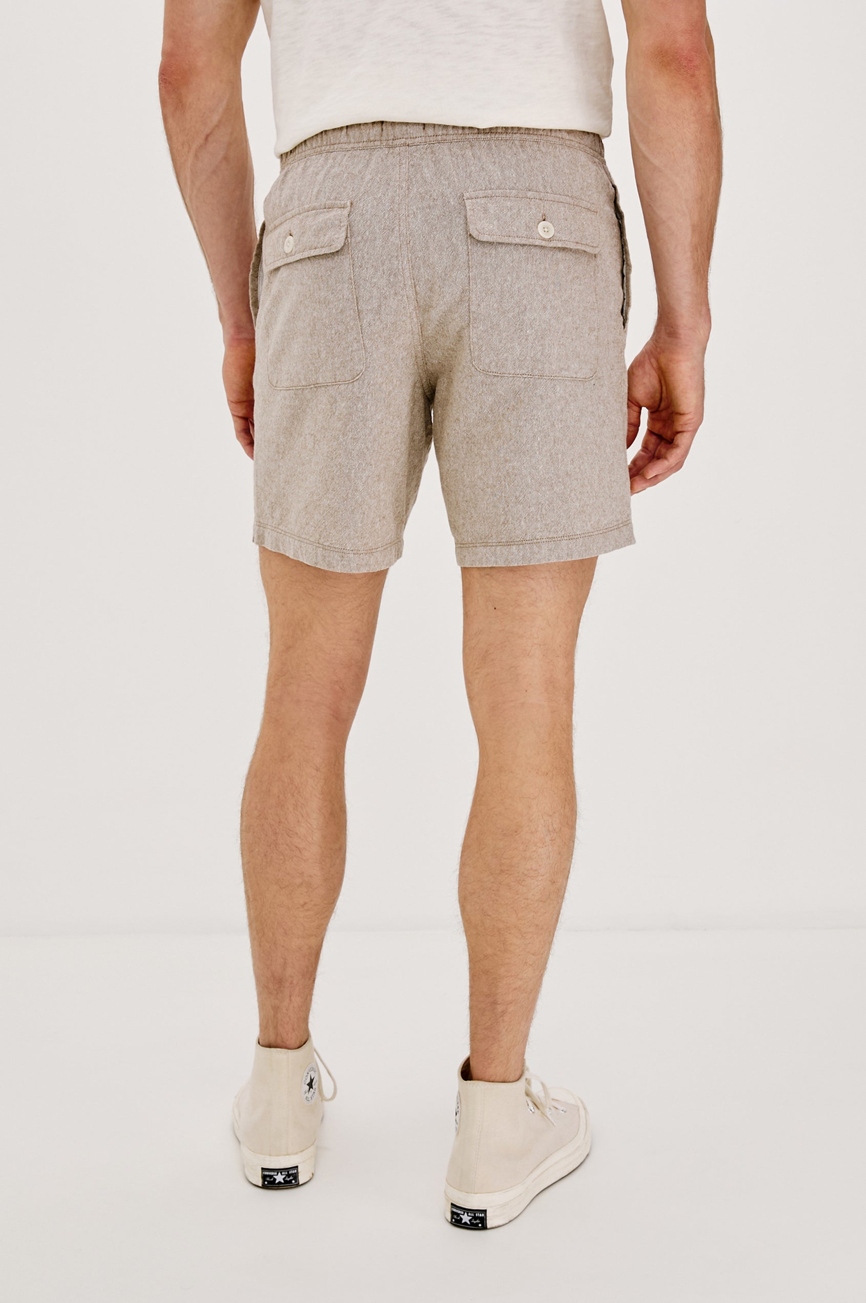Martin Pull on Short with a an Elastic and Drawstring Waist and Side Pockets in Bulgur Oat Colorway. Back View Shown on Model.