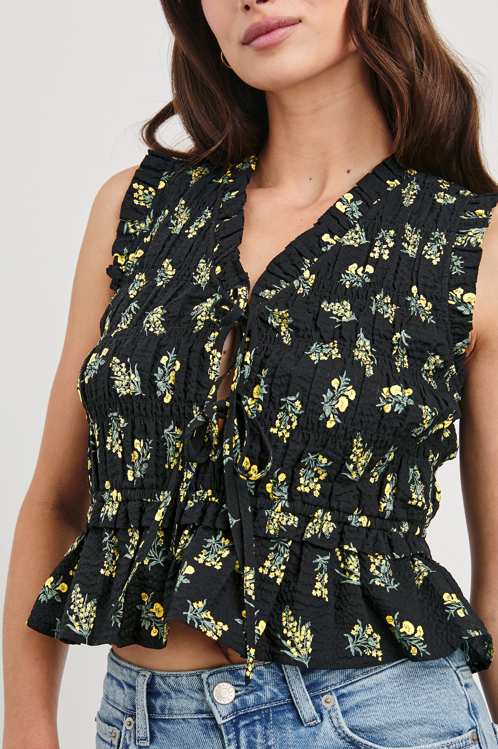 Martine peplum tank top with adjustable front closure ties in Dark Amaryllis - close up of details on model