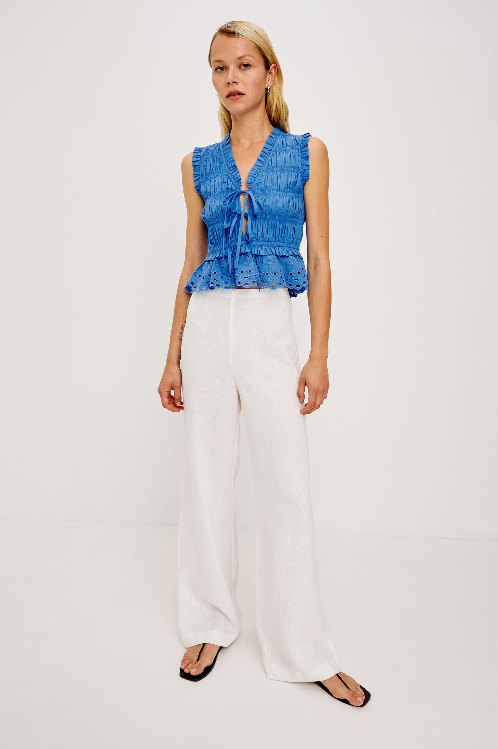 Martine Cropped Sleeveless Top in Heavy Cotton Poplin With Plunging V-Neckline With Adjustable Ties and Ruffle Trim in Harbor Blue Colorway - Full Body Front View Featured on Model
