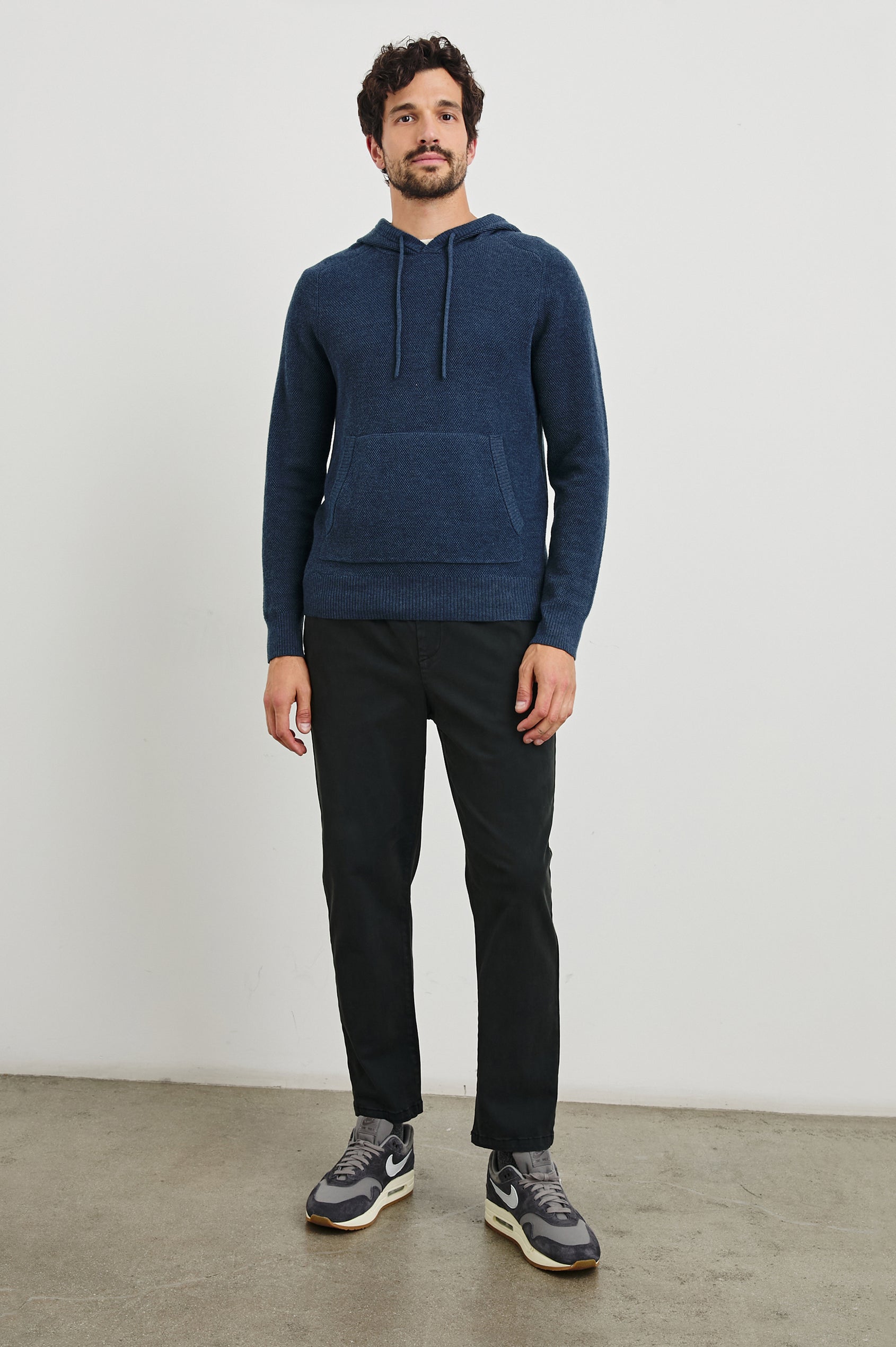 Matador Hoodie with Drawstring ties and a Kangaroo Pocket in Blue Melange Colorway - Front Full Body View Featured on Model