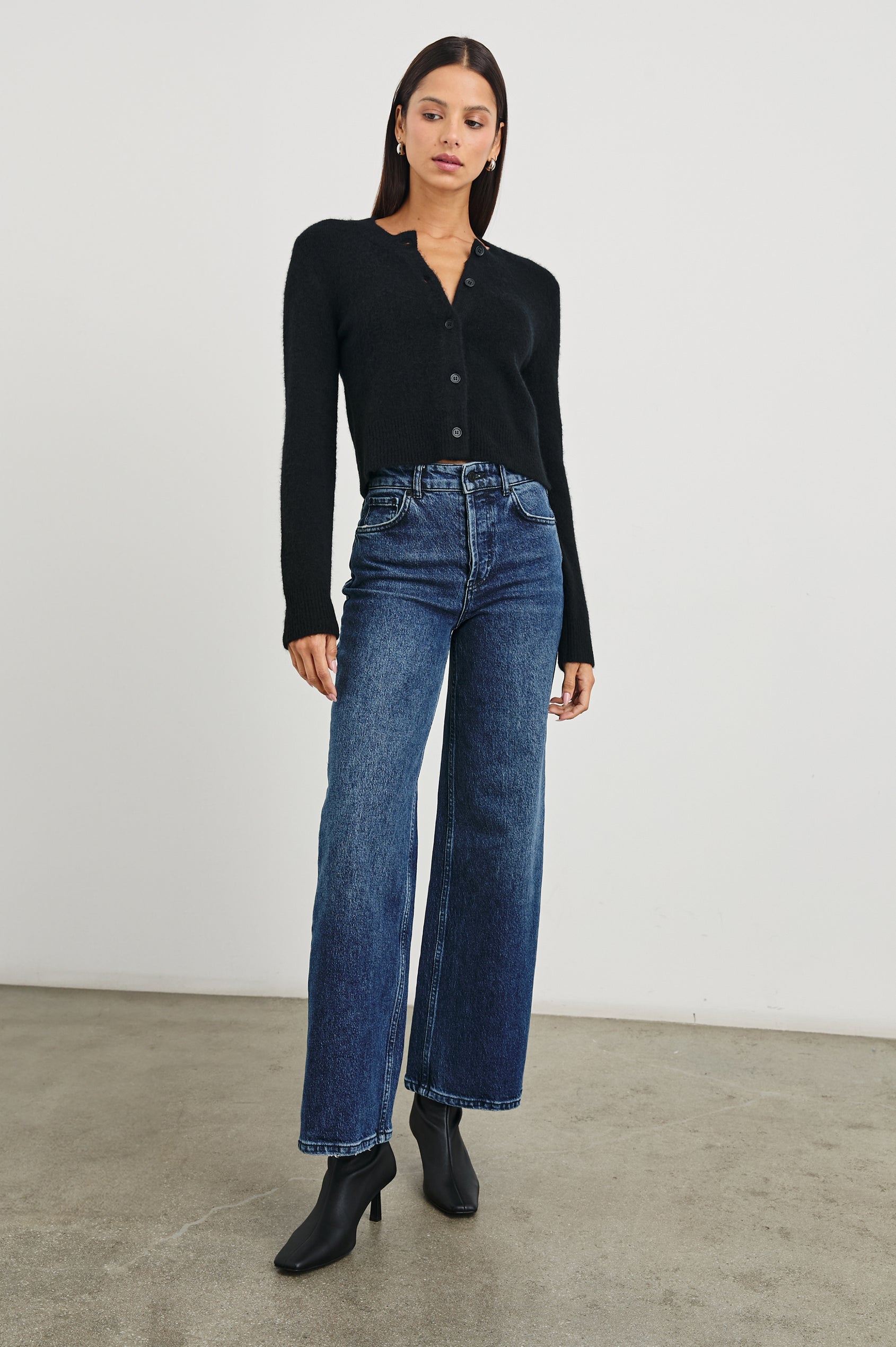 Matilda Cropped Long-Sleeve Sweater with Button Closure, Crew Neck and Ribbed Trim in Black Colorway - Front Full Body View Featured on Model