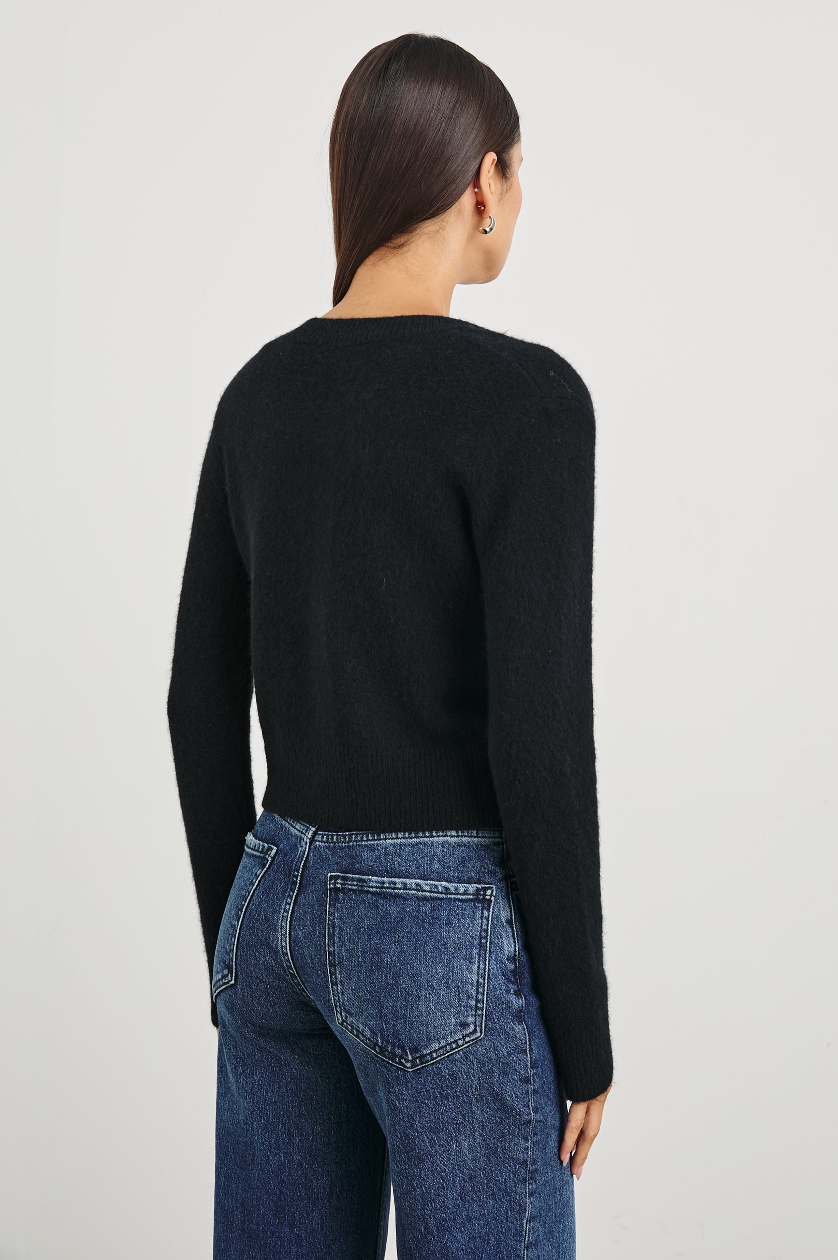 Matilda Cropped Long-Sleeve Sweater with Button Closure, Crew Neck and Ribbed Trim in Black Colorway - Back View Featured on Model