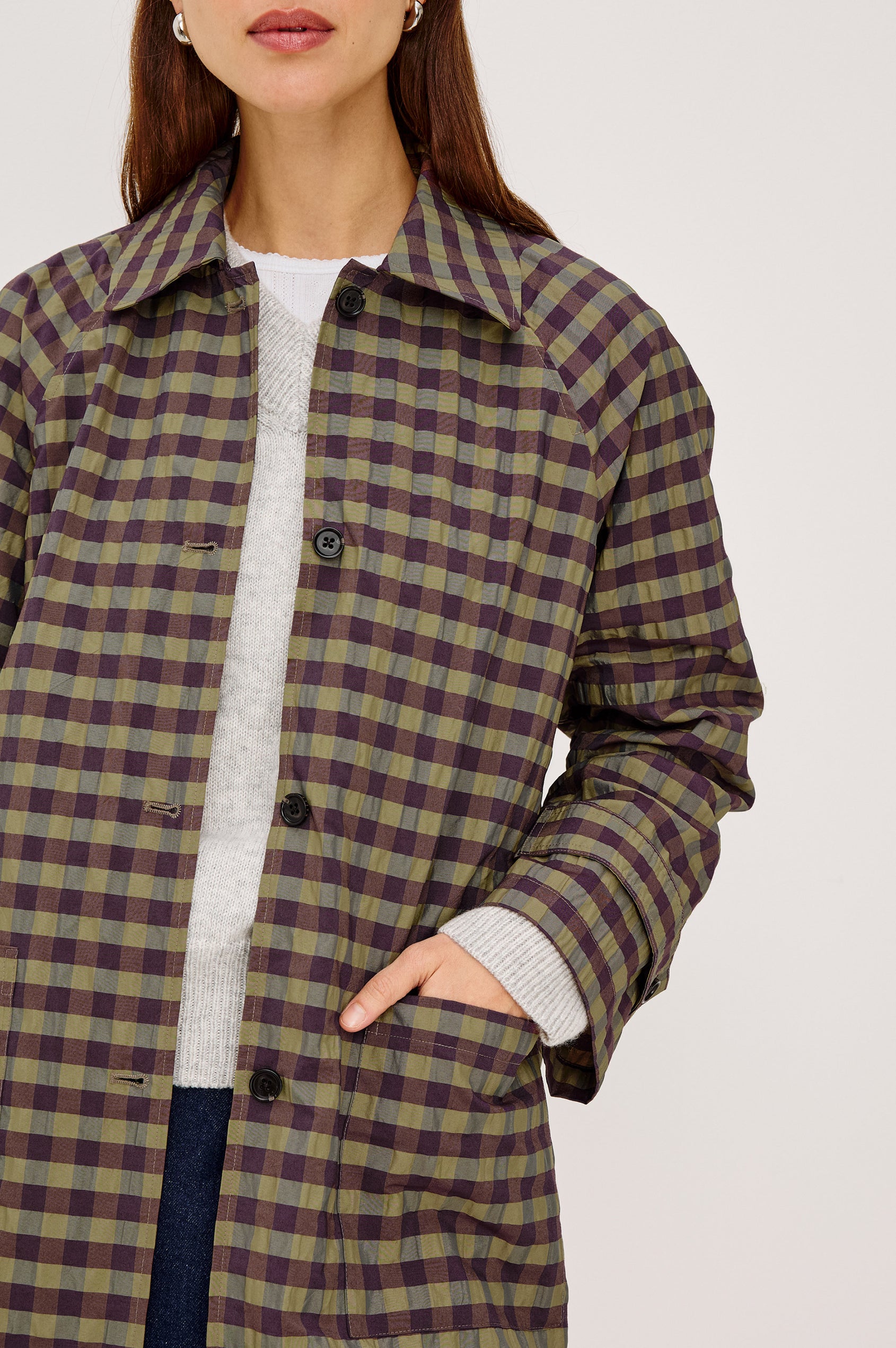 Mattie Trench Jacket in Lightweight Crinkle Nylon With Slightly Oversized Fit, Point Collar, Front Buttons, Front Patch Pockets, and Side Slits in Tapenade Check Colorway - Upper Body Front View Featured on Model