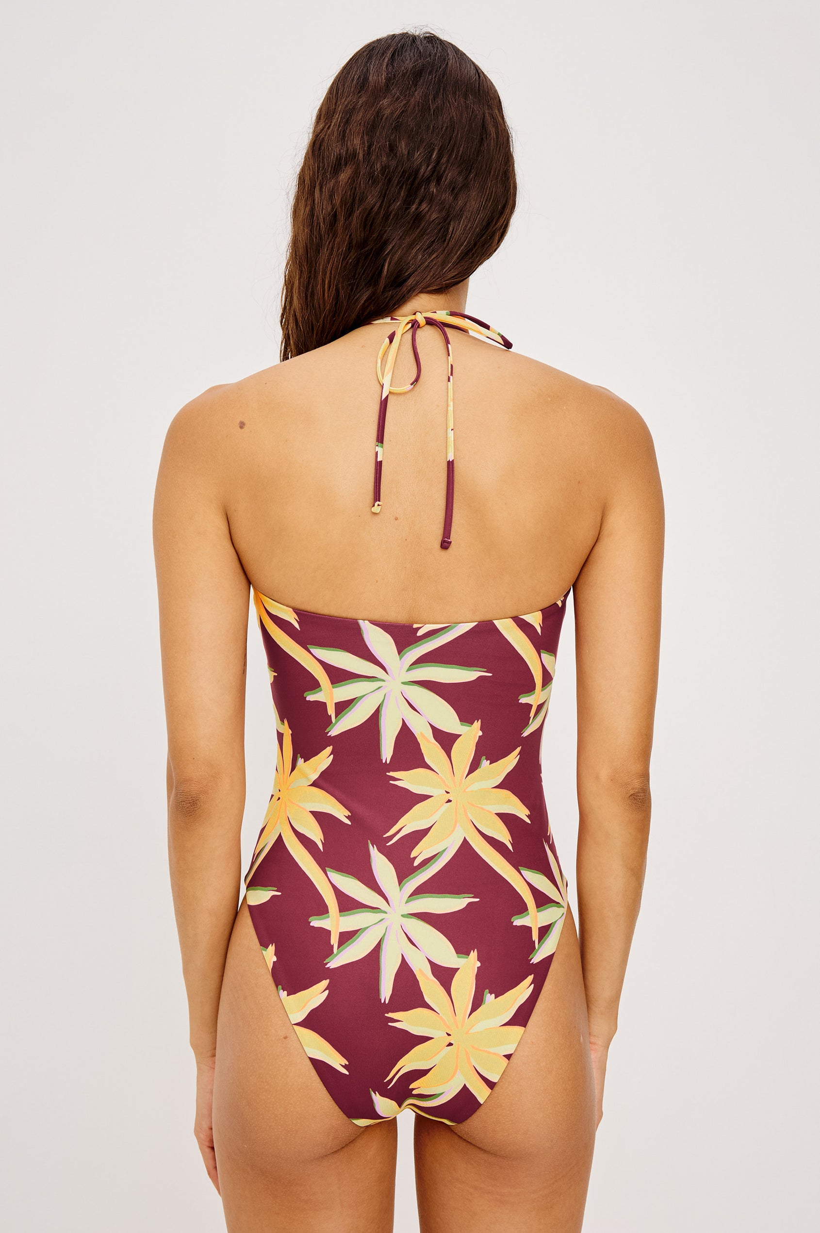 Maui One Piece Swimsuit With Adjustable Halter Chest Crisscross Ties, Ruched Keyhole Cut Out Bust, and Classic Rear Coverage in Red Palma Colorway - Upper Body Back View Featured on Model