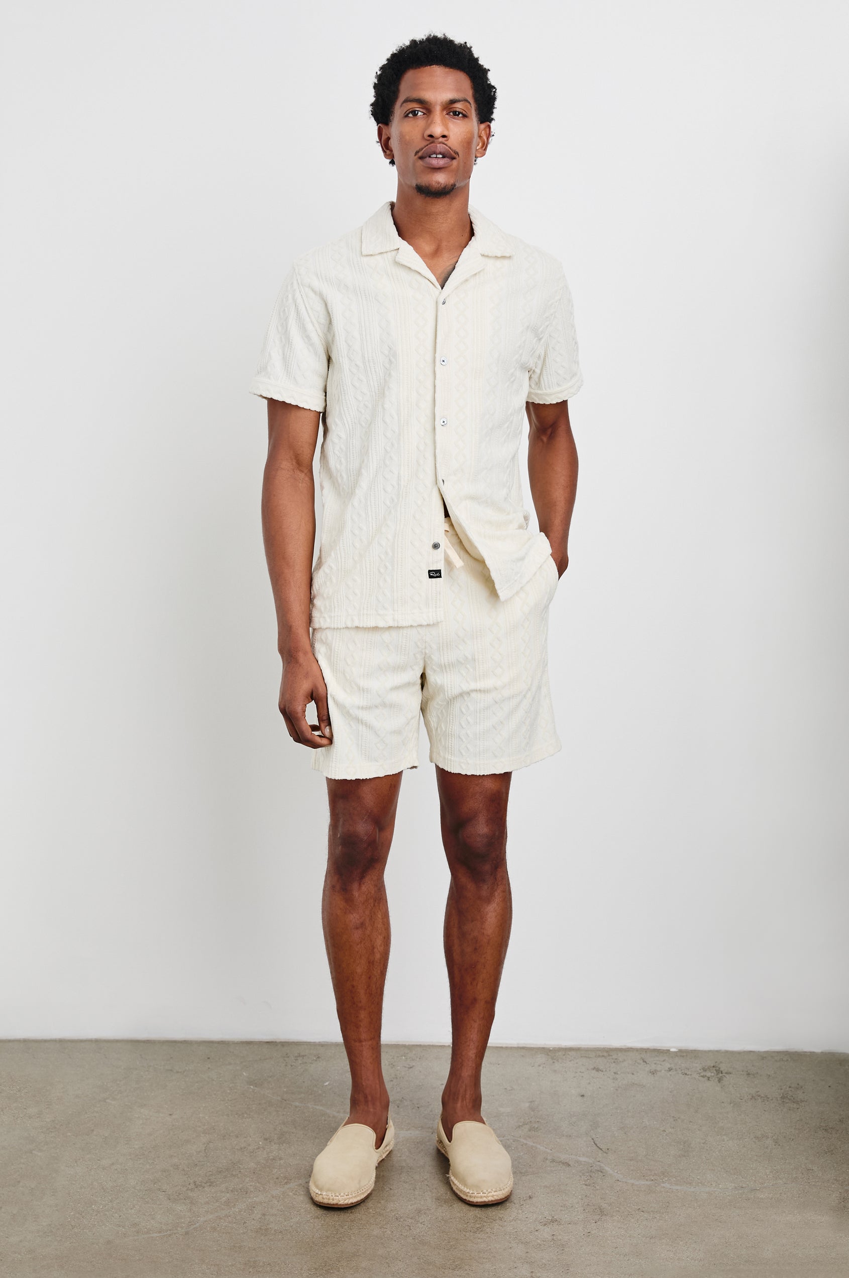 Maverick Short Sleeve Button Up with a raised jacquard pattern in Ecru Colorway - Front Full Body View Featured on Model