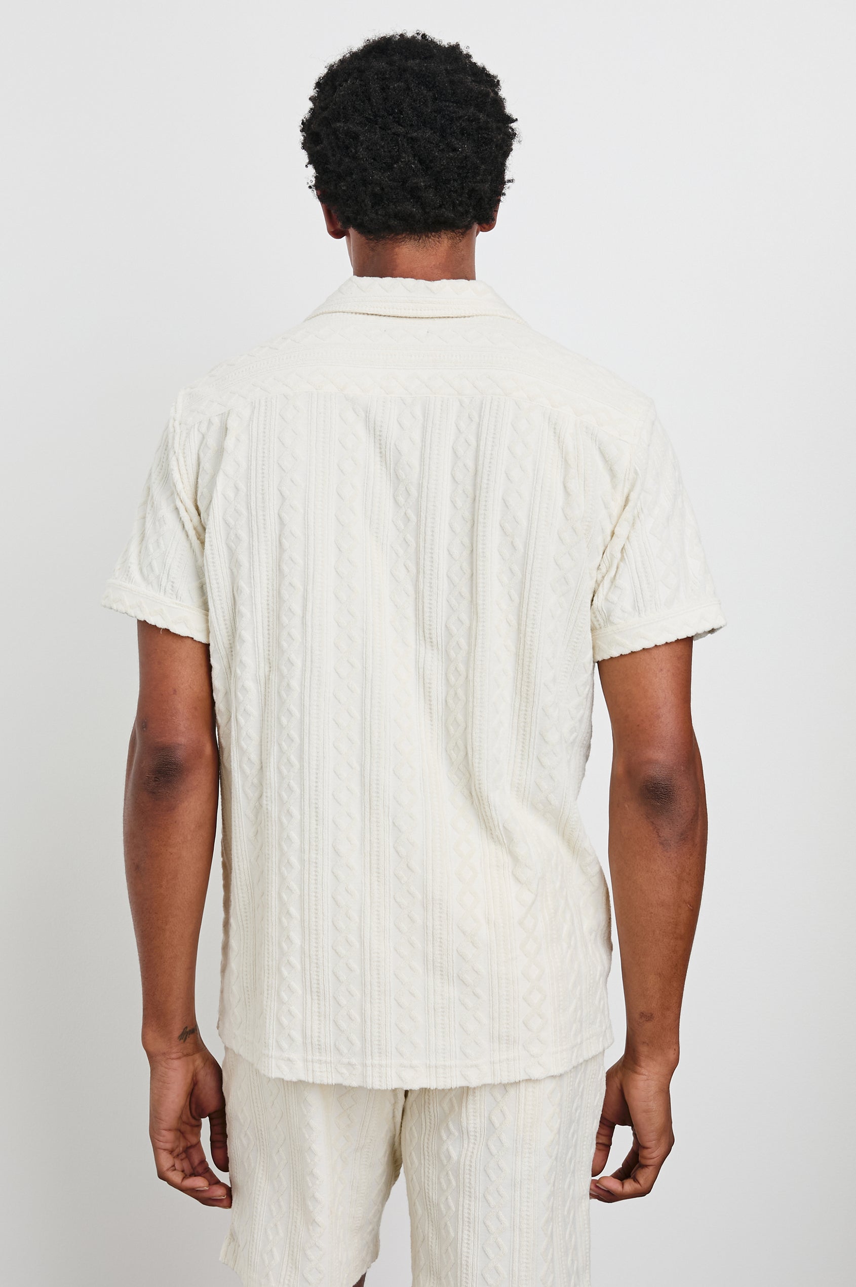 Maverick Short Sleeve Button Up with a raised jacquard pattern in Ecru Colorway - Back View Featured on Model