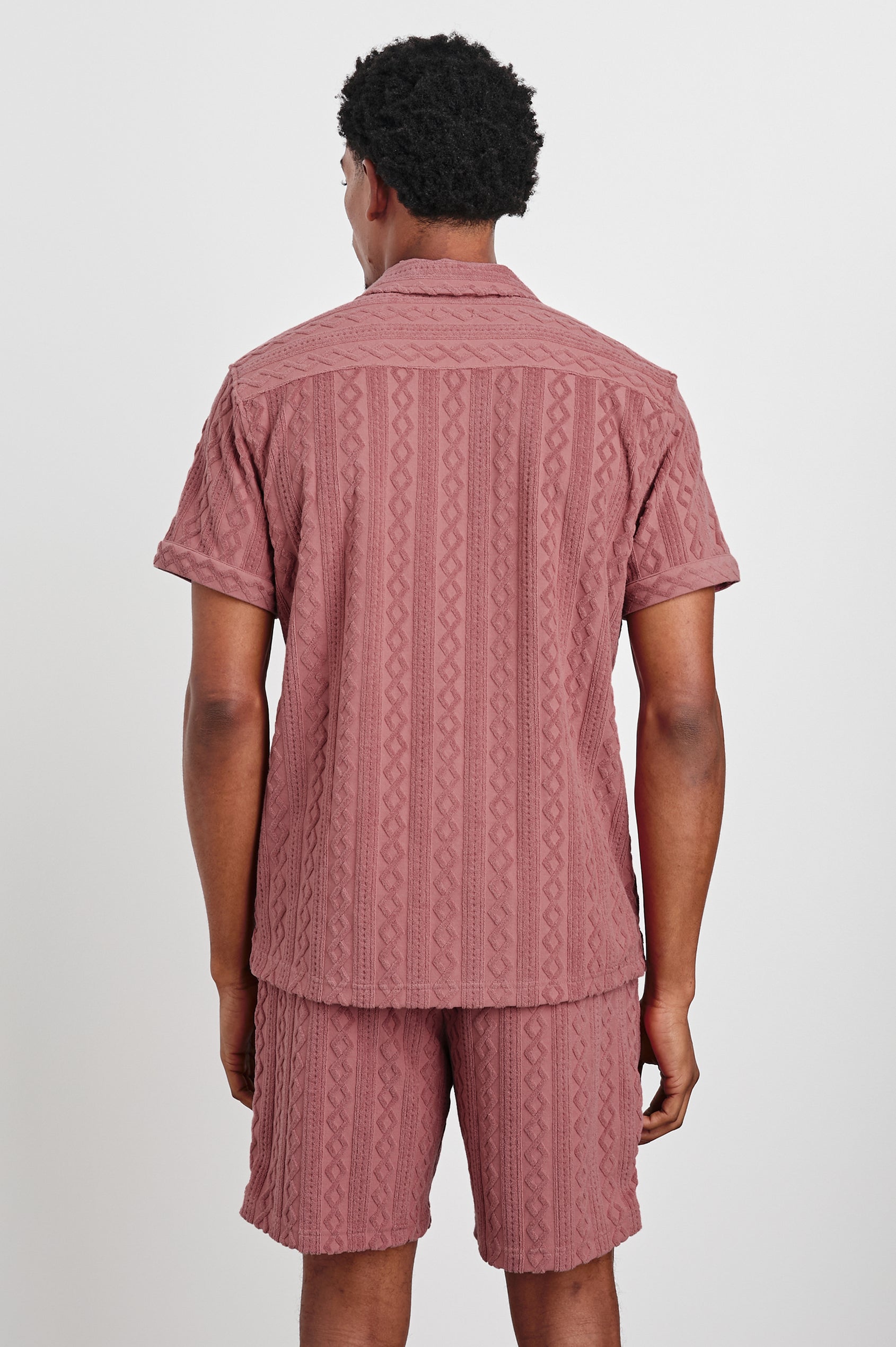 Maverick terry short sleeve with raised jacquard pattern and front buttons in Faded Red - back view on model
