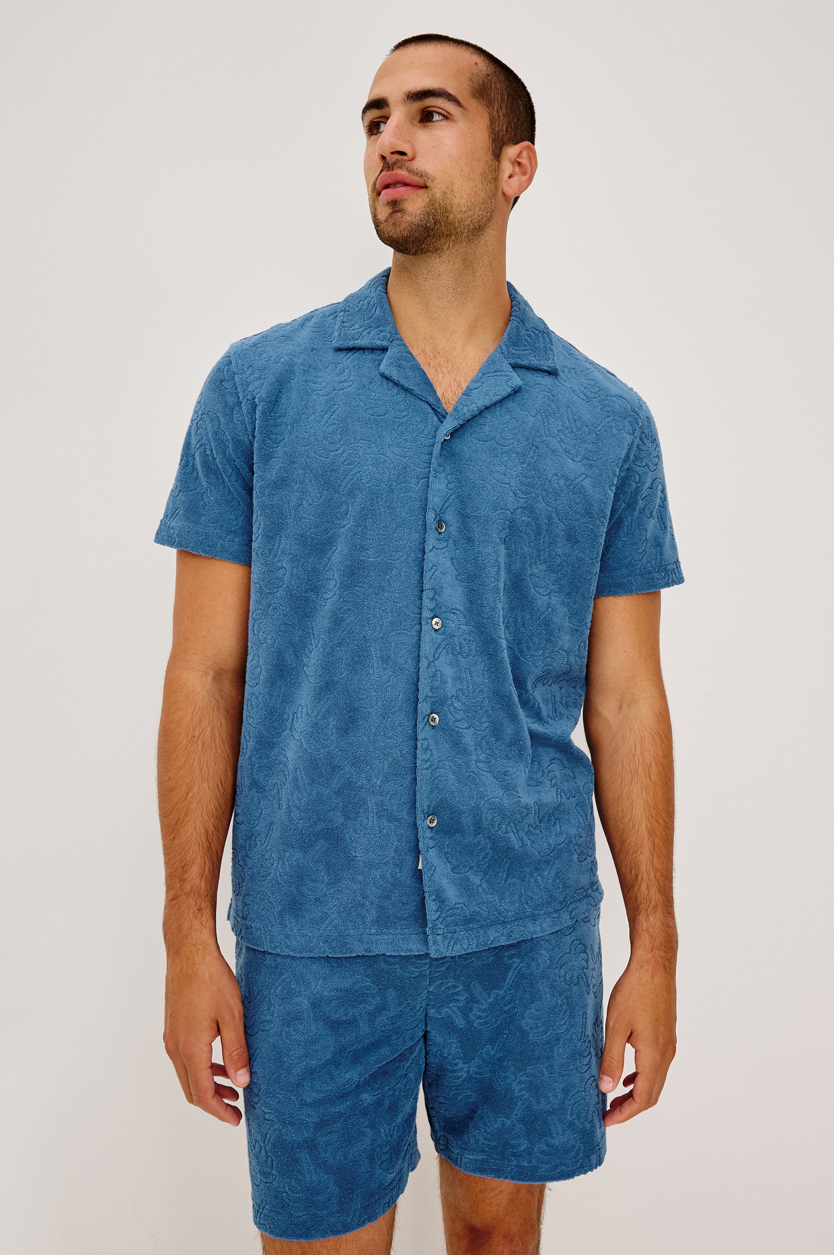 Maverick Short Sleeve Shirt in French Terry With Jacquard Pattern, Notched Collar, Front Buttons, and Classic Fit in Royal Palm Colorway - Full Body Front View Featured on Model