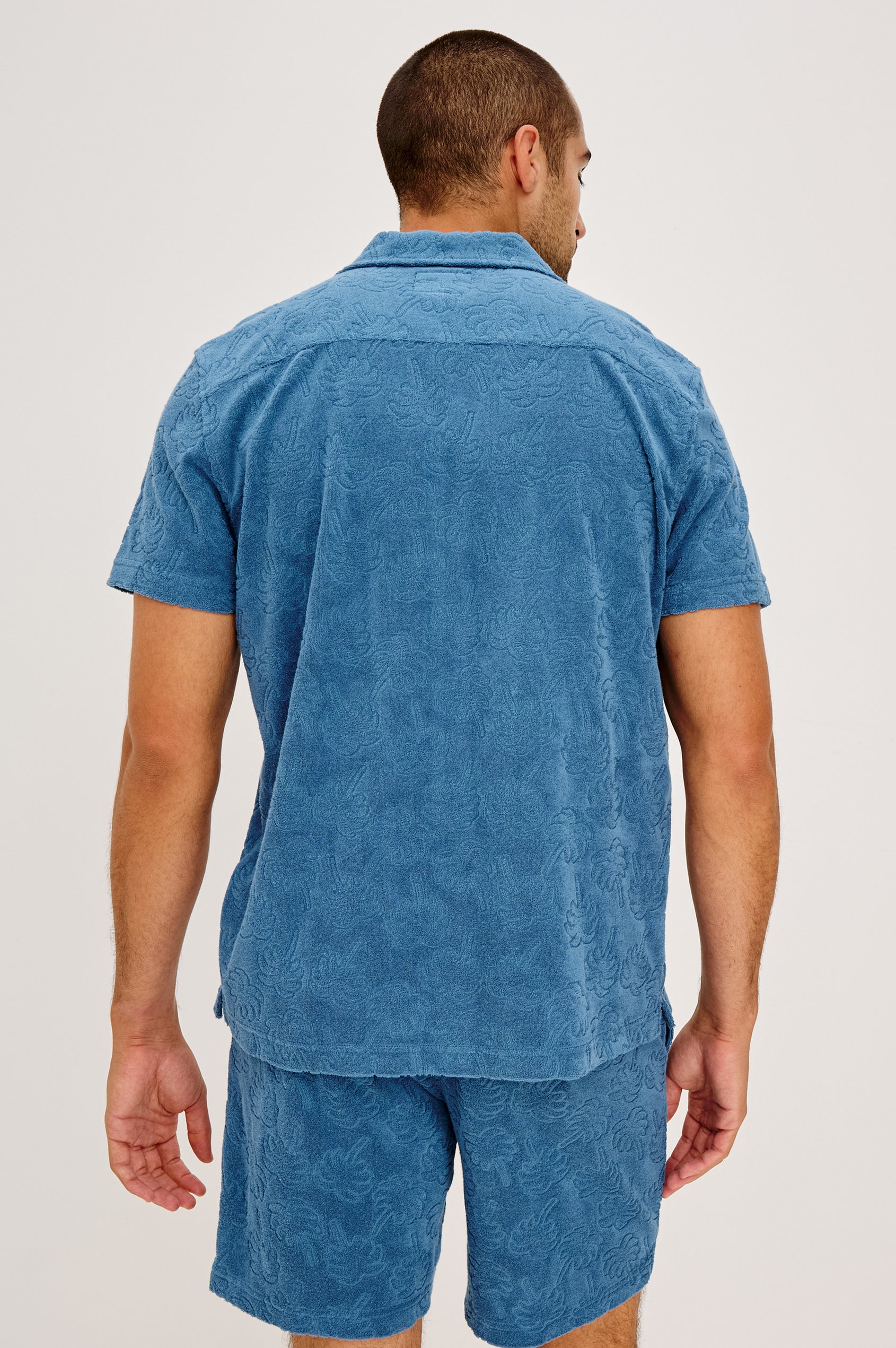 Maverick Short Sleeve Shirt in French Terry With Jacquard Pattern, Notched Collar, Front Buttons, and Classic Fit in Royal Palm Colorway - Full Body Front View Featured on Model
