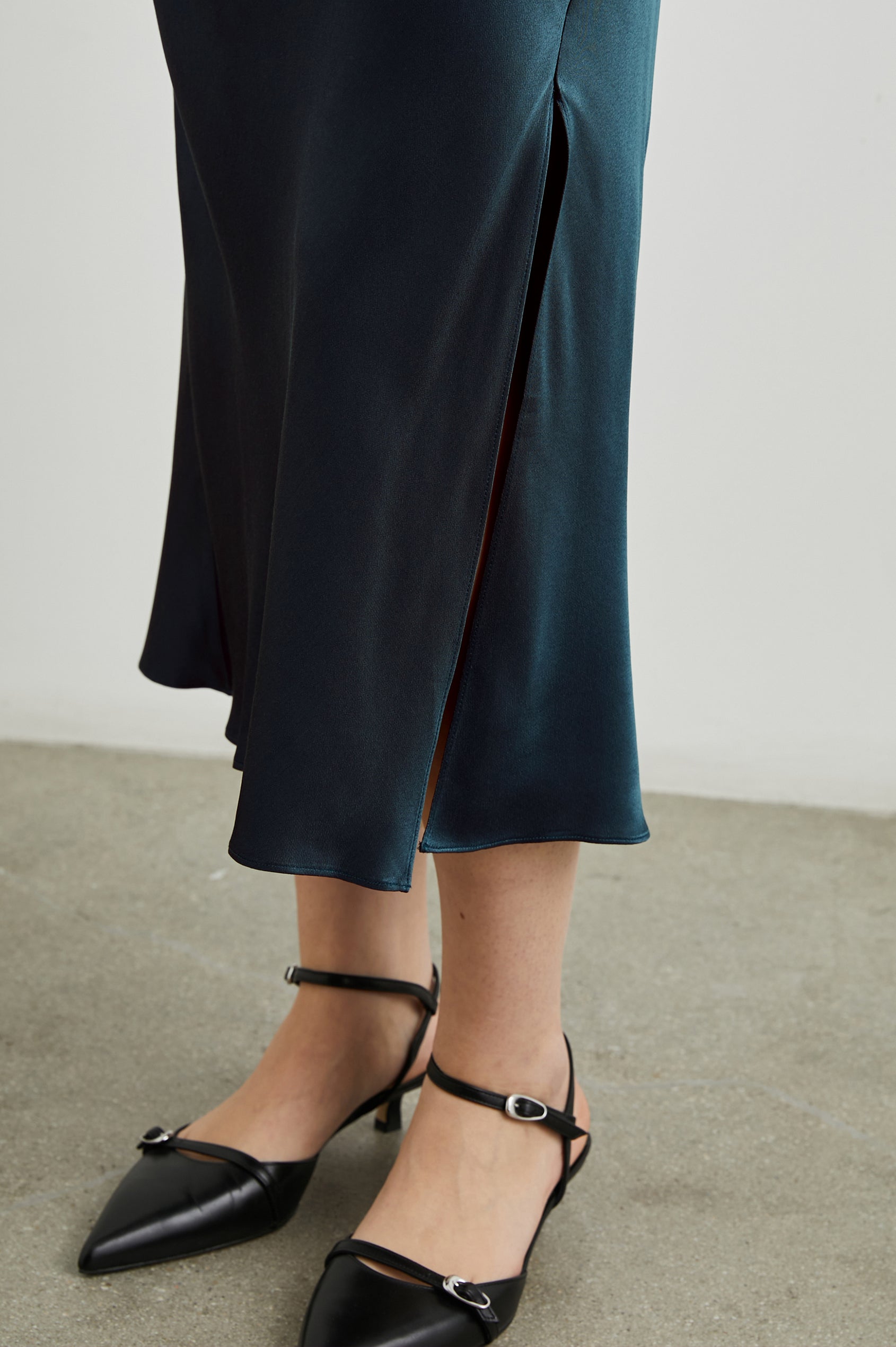 Maya Midi Skirt with Mid-Thigh Side Slit in Deep Sea Colorway - Front View Featured on Model