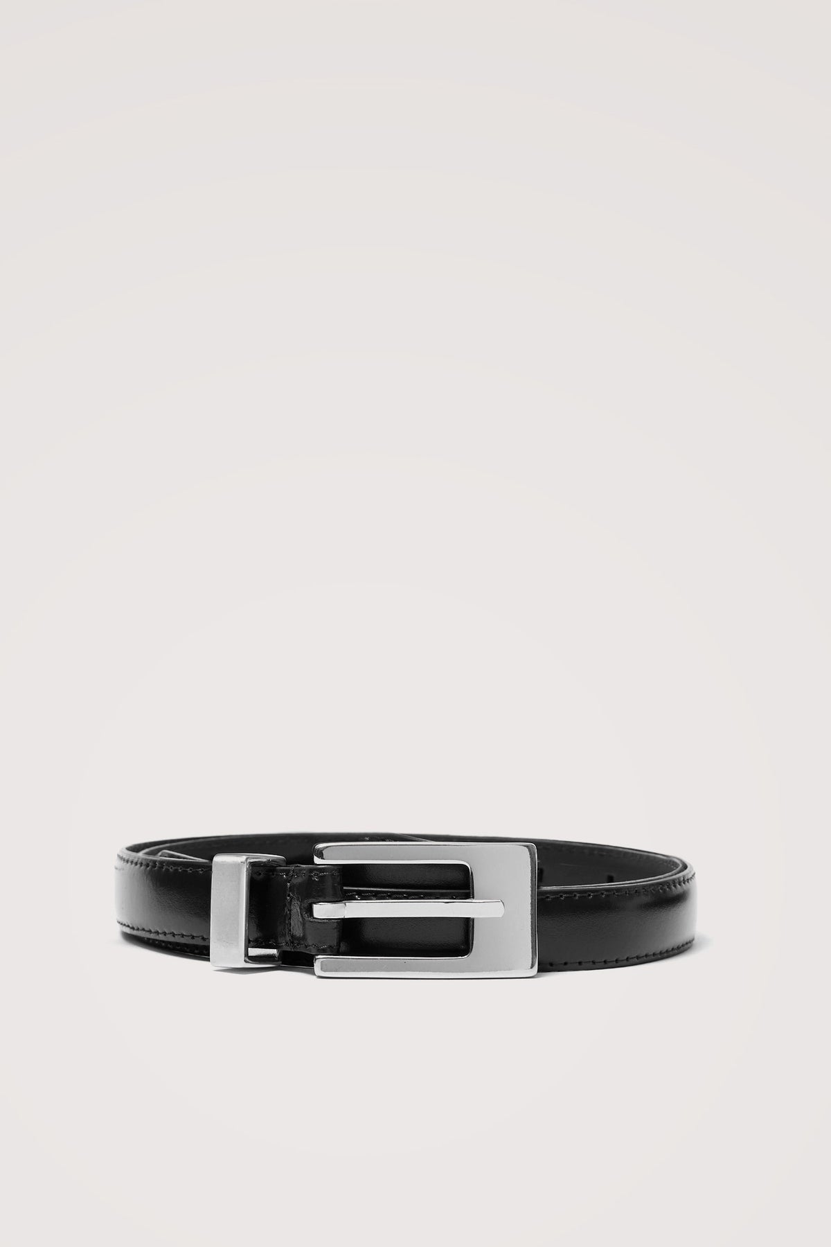 Mayfair Belt in Italian Leather with a Clean Rectangular Buckle in Black Silver Colorway - Front View Featured on Model.
