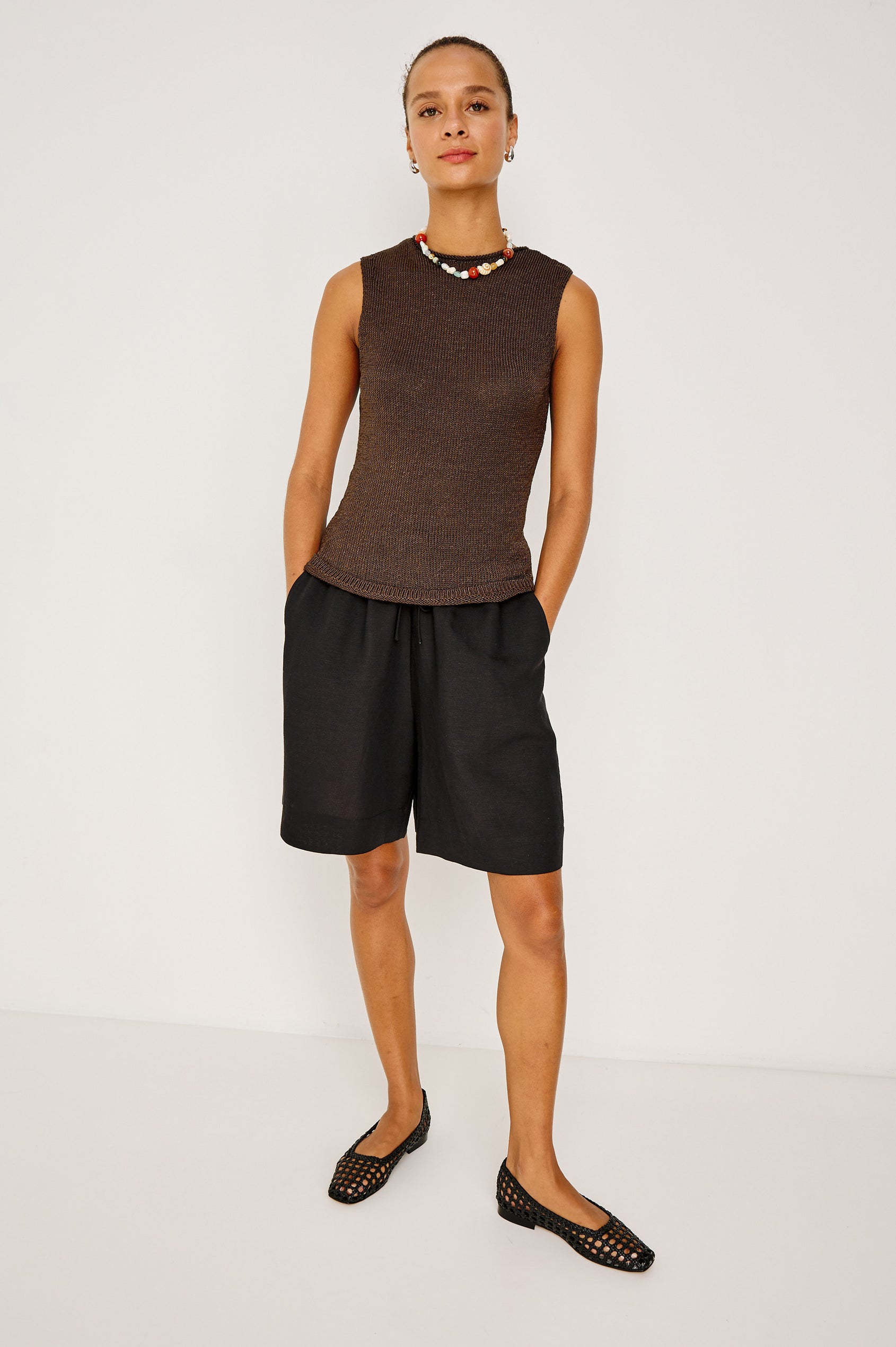 McGuire Mid-Rise Short in Linen Viscose With Bermuda Length, Elastic Waist With Drawcords, Pockets, and Loose Relaxed Fit in Black Colorway - Full Body Front View Featured on Model