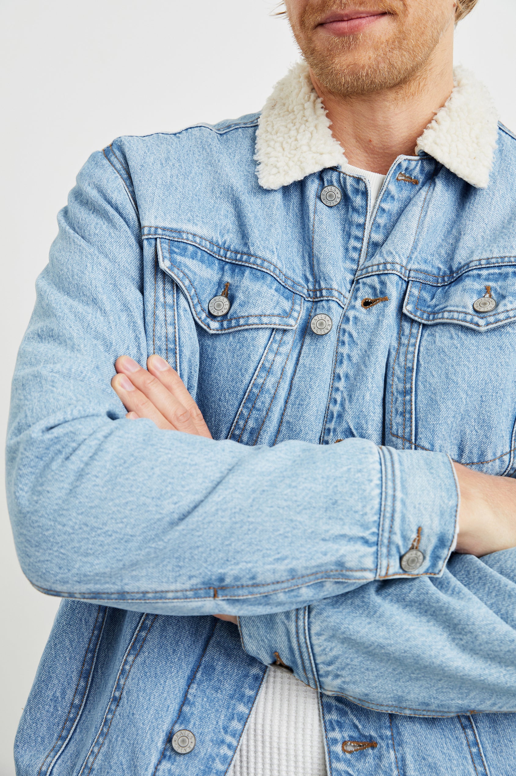 McKinley Denim Jacket with Button Closure, Two Chest Button Flap Pockets and a Cream Faux Sherpa Collar in Vintage Wash Colorway - Front View Featured on Model