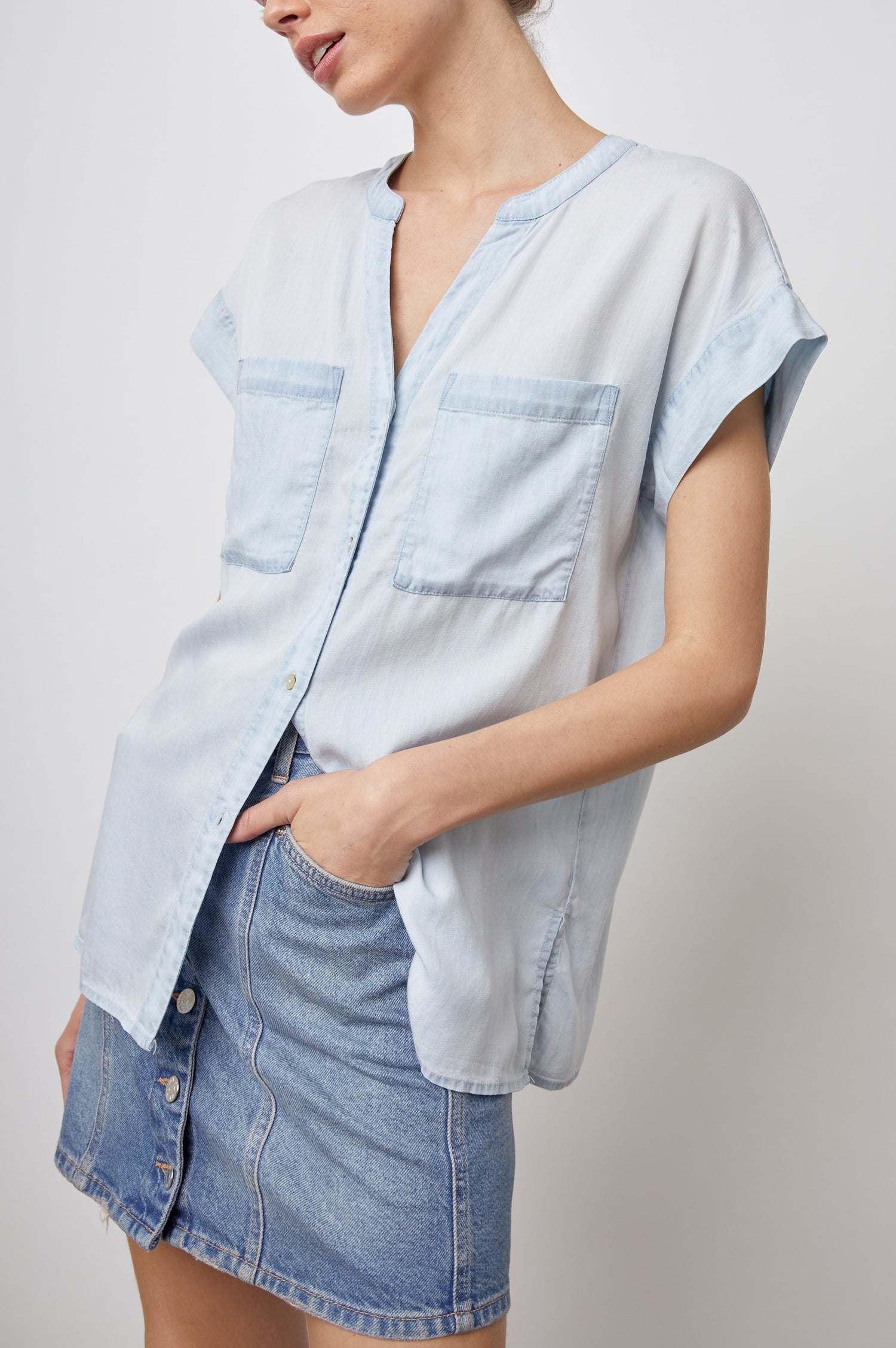 Mel Short-Sleeve top with a V neck, Buttons down the Front, and Two Chest Patch Pockets in Light Vintage Colorway - Front View Featured on Model