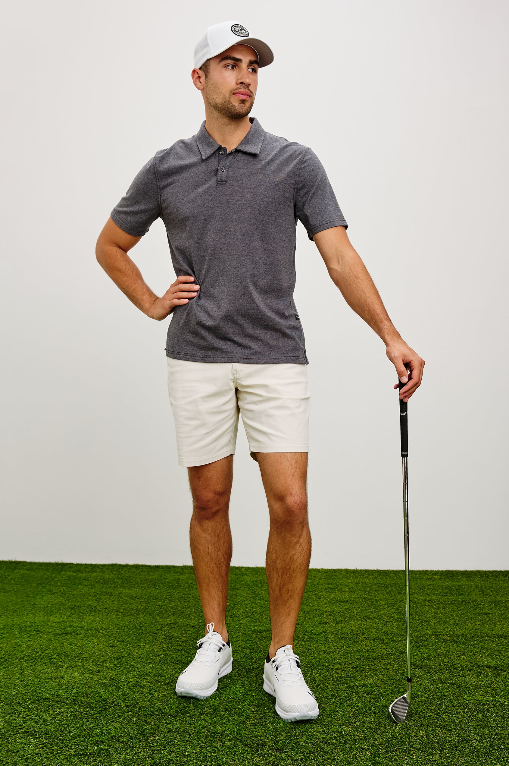 Merced Golf Polo in TENCEL™ Poly Blend With Collar, Quarter Placket, Short Sleeves, and Classic Fit in Charcoal Heather Stripe Colorway - Full Body Front View Featured on Model