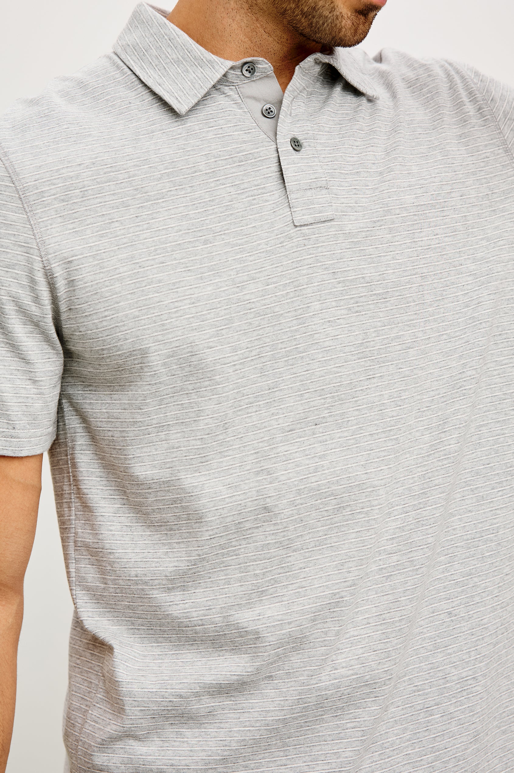 Merced Golf Polo in TENCEL™ Poly Blend With Collar, Quarter Placket, Short Sleeves, and Classic Fit in Heather Grey Stripe Colorway - Upper Body Front View Featured on Model