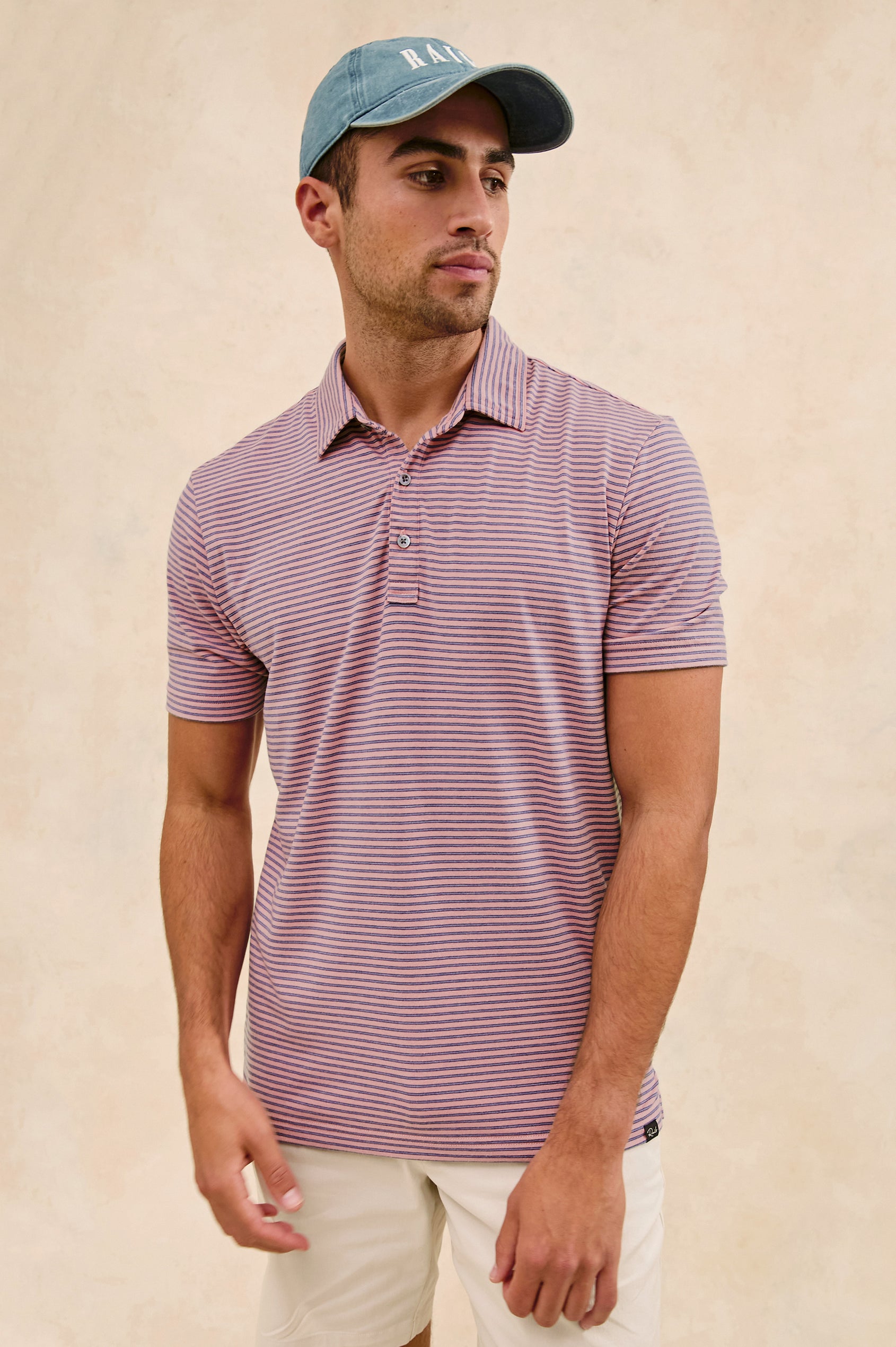 Merced short sleeve athletic Golf Polo with two button placket and collar in Hibiscus Mirage Stripe - stylized front view on model