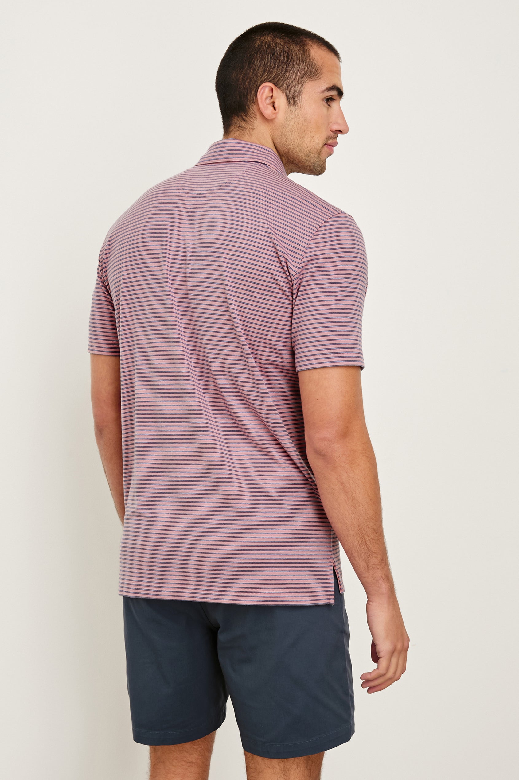 Merced short sleeve athletic Golf Polo with two button placket and collar in Hibiscus Mirage Stripe -back view on model