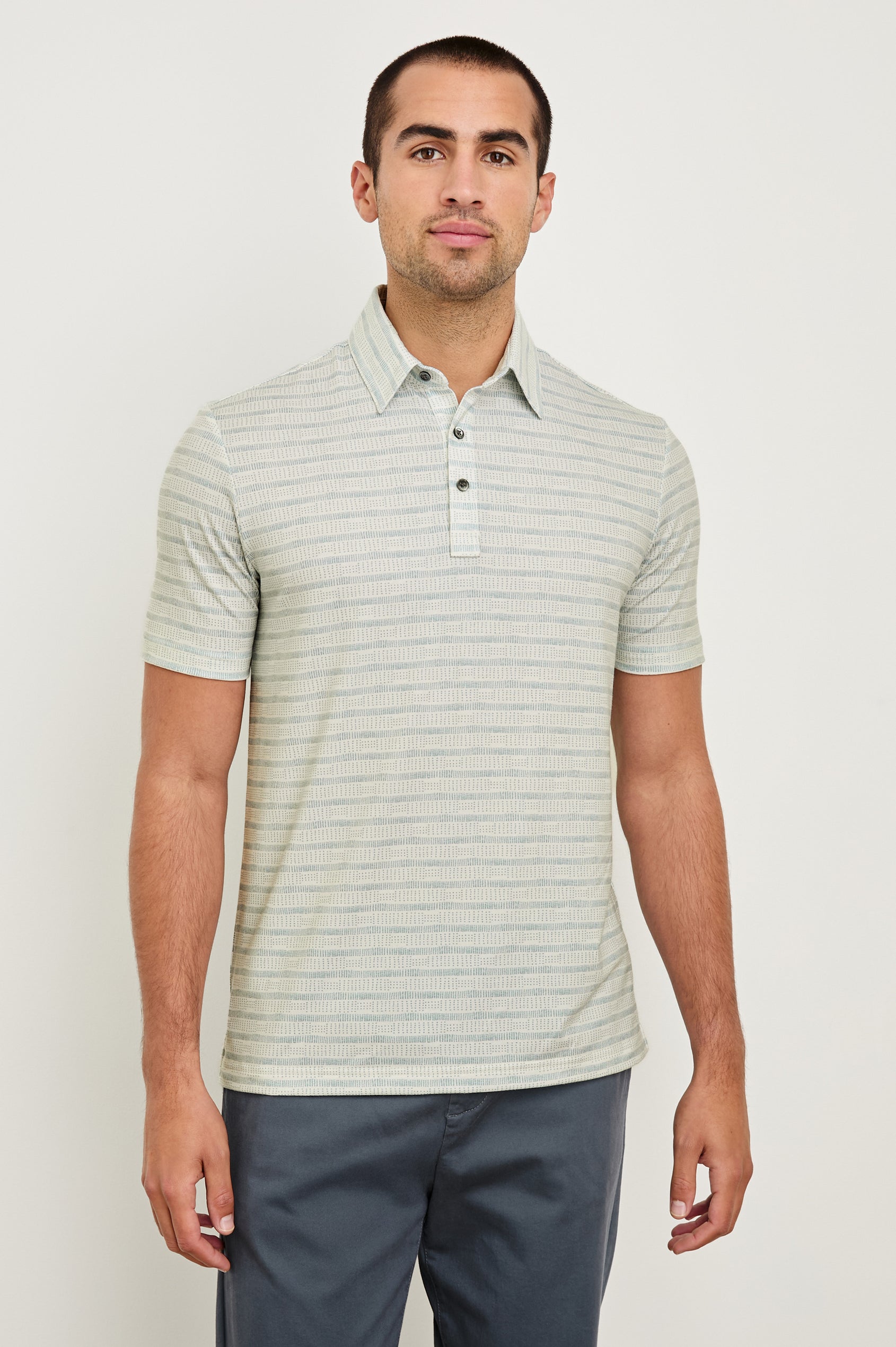 Merced short sleeve athletic Golf Polo with two button placket and collar in Sashiko Border White - front view on model