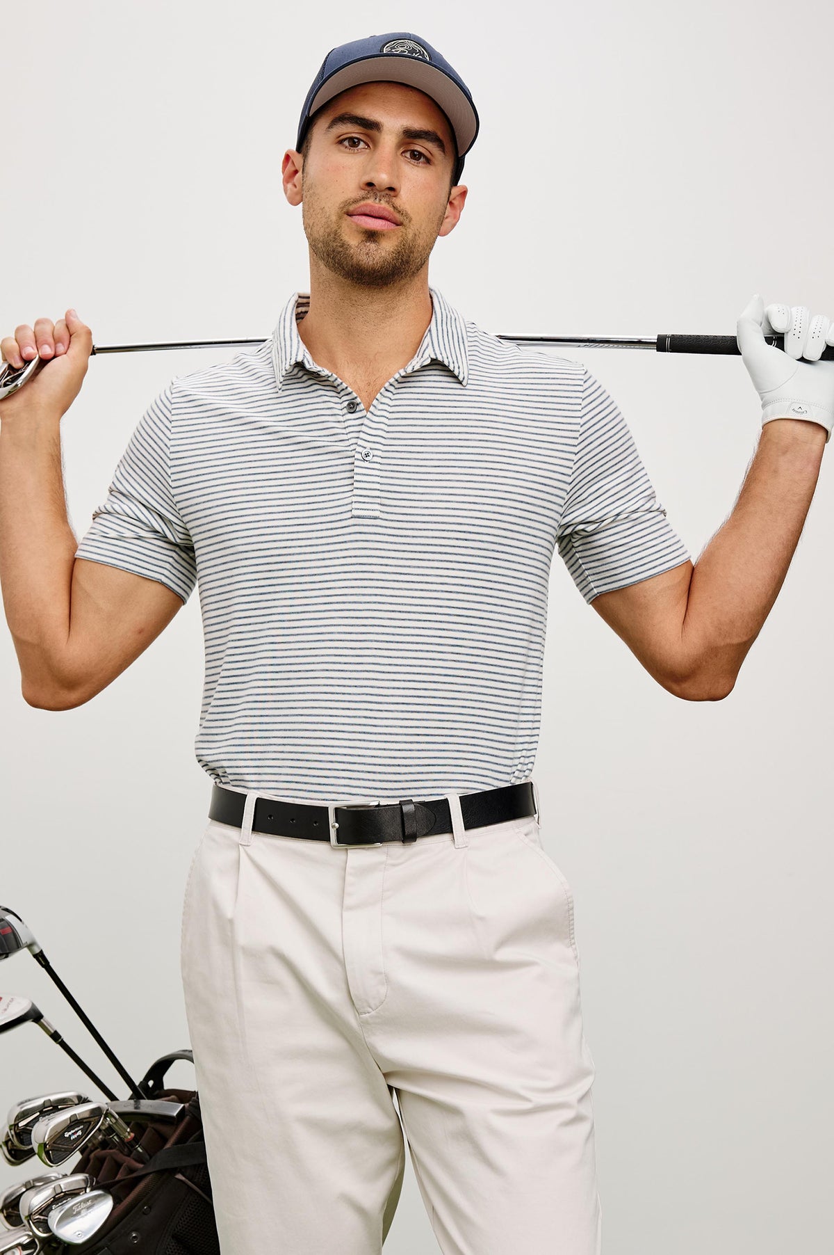 Merced Golf Polo in TENCEL™ Poly Blend With Collar, Quarter Placket, Short Sleeves, and Classic Fit in White Cosmos Stripe Colorway - Upper Body Front View Featured on Model