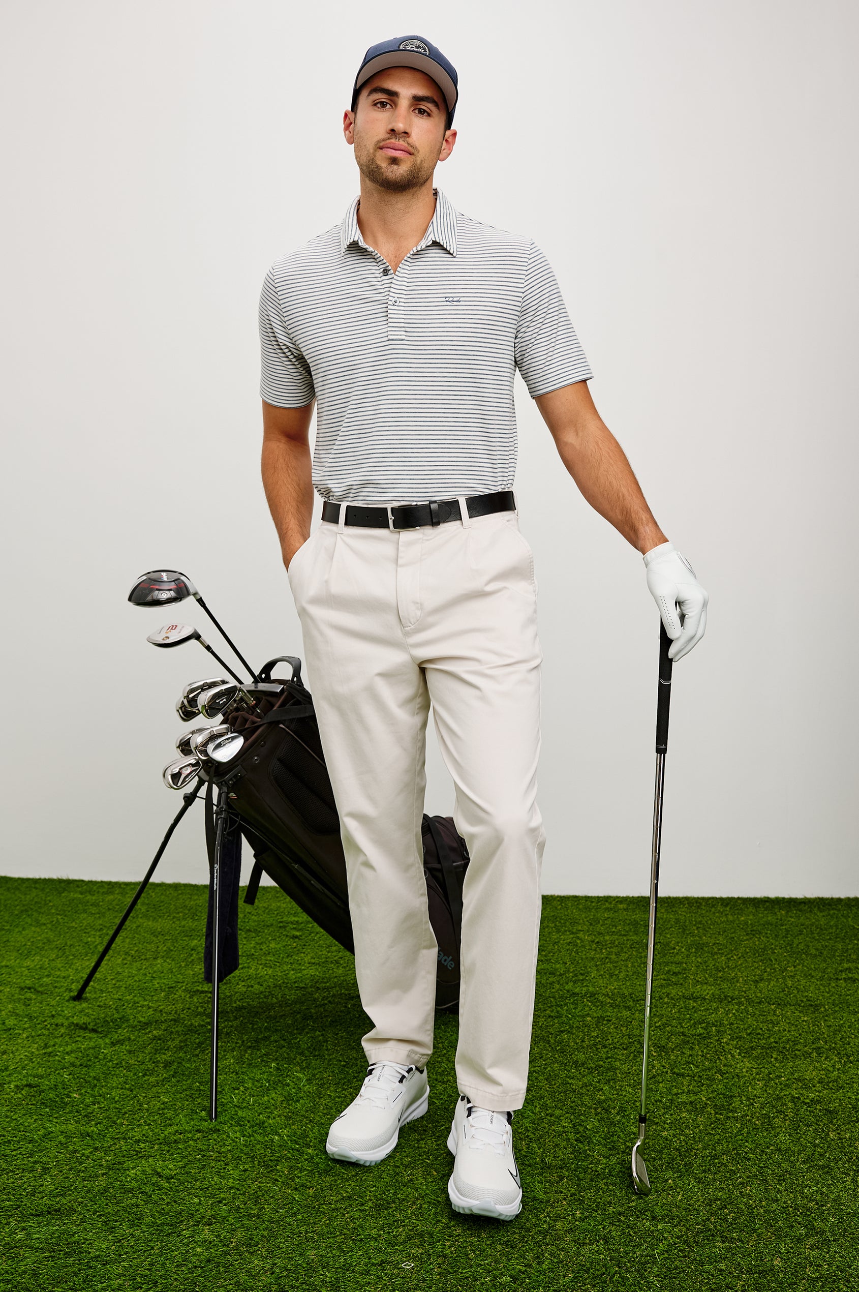 Merced Golf Polo in TENCEL™ Poly Blend With Collar, Quarter Placket, Short Sleeves, and Classic Fit in White Cosmos Stripe Colorway - Full Body Front View Featured on Model