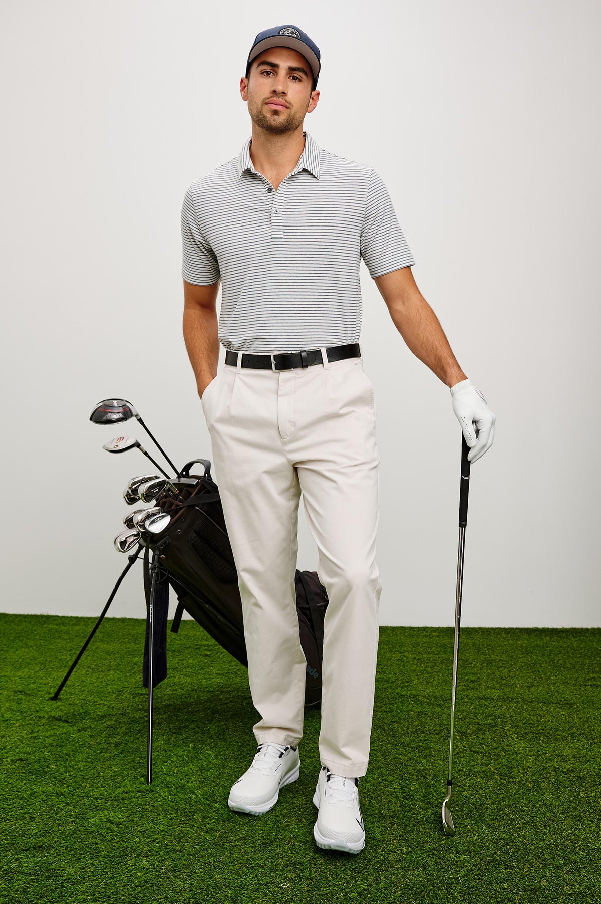 Merced Golf Polo in TENCEL™ Poly Blend With Collar, Quarter Placket, Short Sleeves, and Classic Fit in White Cosmos Stripe Colorway - Full Body Front View Featured on Model