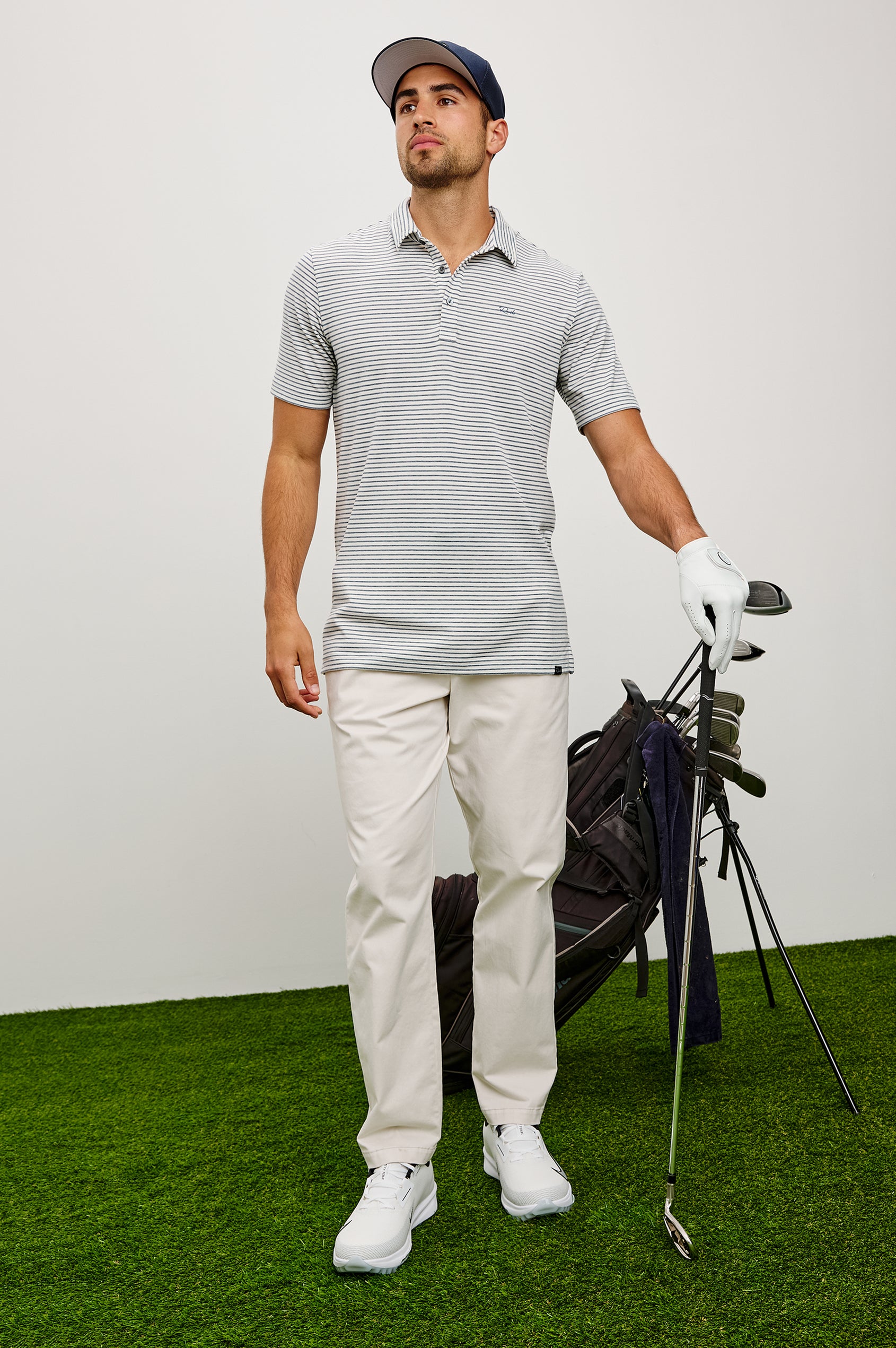 Merced Golf Polo in TENCEL™ Poly Blend With Collar, Quarter Placket, Short Sleeves, and Classic Fit in White Cosmos Stripe Colorway - Full Body Front View Featured on Model