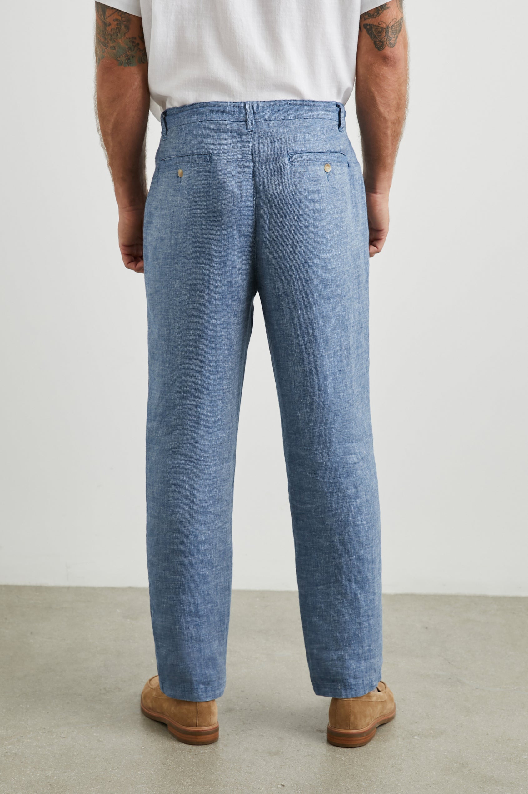 Mercer Pants with a Button and Drawcord Waist, Belt Loops, Two Front Pockets and Two Back Button Welt Pockets in Blue Mirage Colorway - Back View Featured on Model