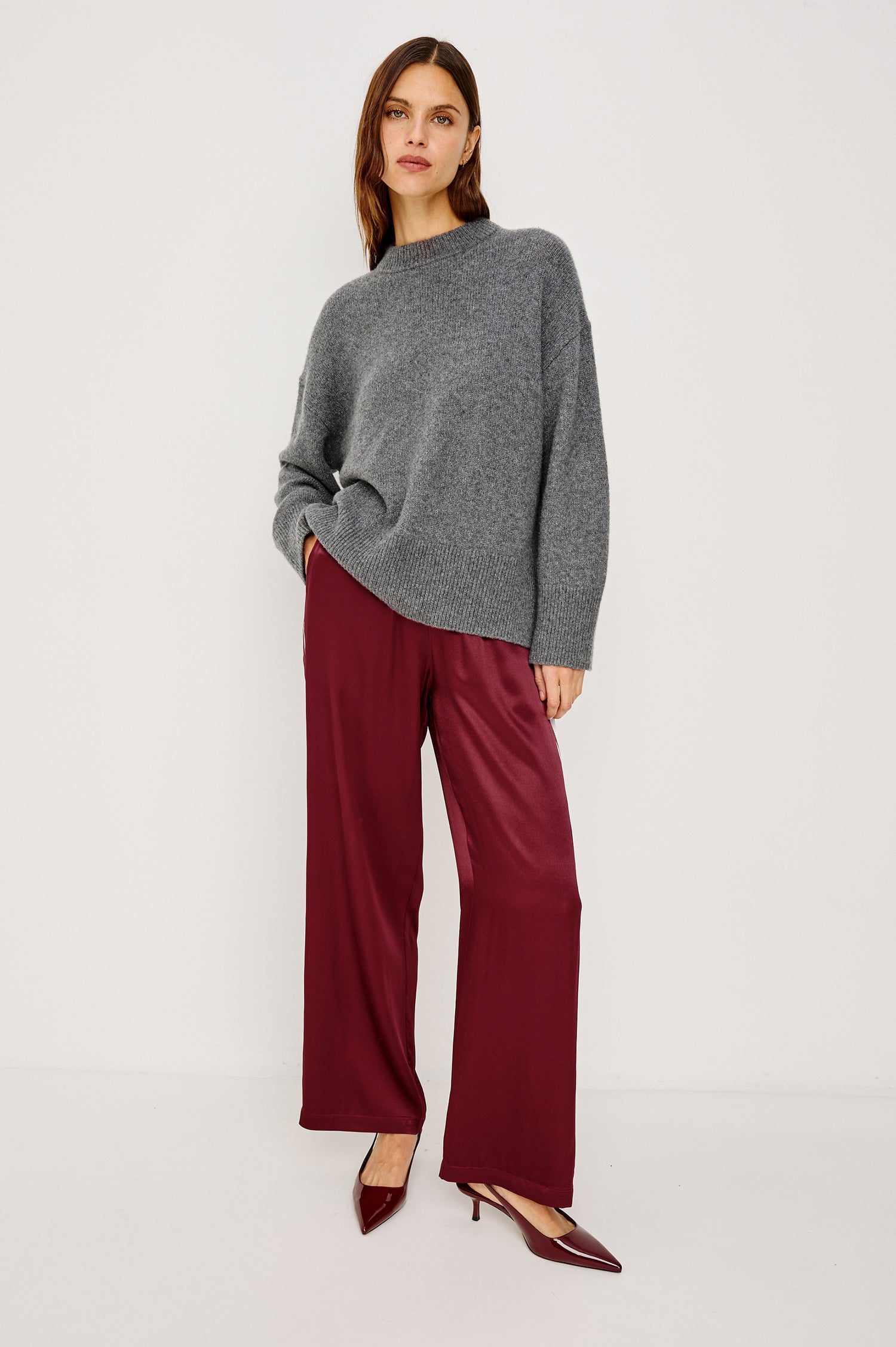 Merida Pant in Satin Back Crepe With Elastic Waistband, Side Pockets, and Wide Legs With Double Side Stripes in Garnet Colorway - Full Body Front View Featured on Model