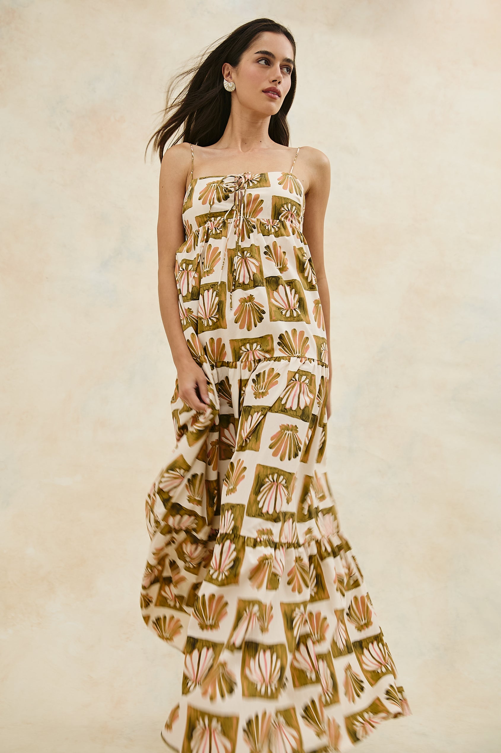 Mica Midi Tank Dress with and Empire Waist, Spaghetti Straps, a Keyhole at Center Front, Ties and a Tiered Skirt in Checkered Shells Colorway. Front View Shown on Model.