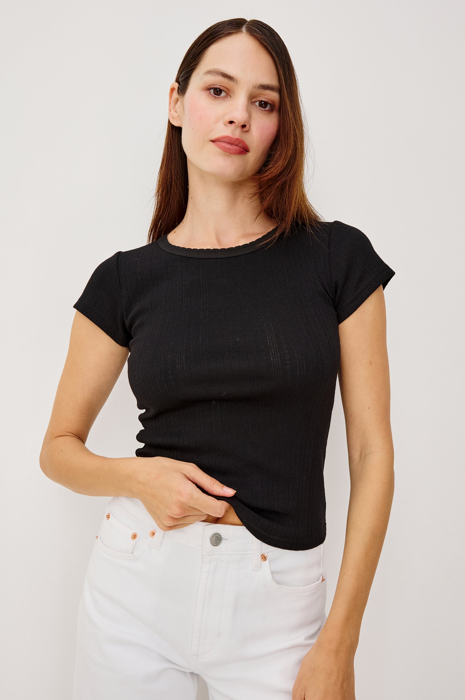 Mickey Fitted Crewneck Short Sleeve Baby Tee With Pleated Rib Pointelle Detailing in Black Colorway - Upper Body Front View Stylized Featuerd on Model