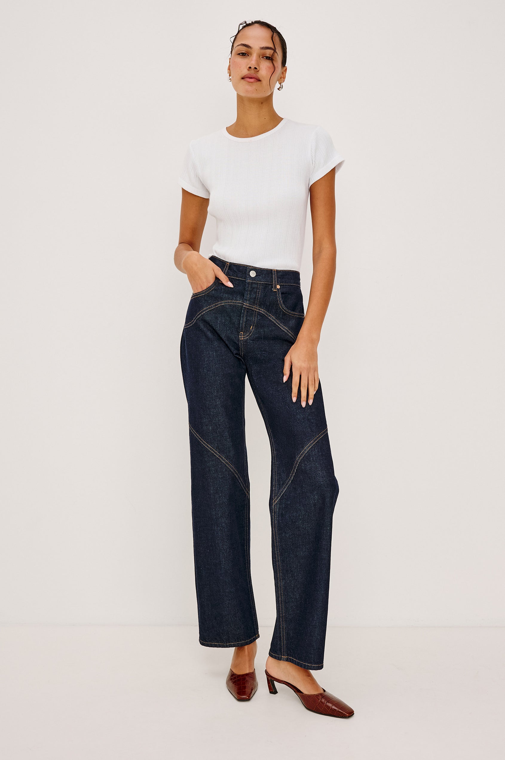 Mickey Fitted Crewneck Short Sleeve Baby Tee With Pointelle Detailing in White Colorway - Full Body Front View Stylized Featuerd on Model