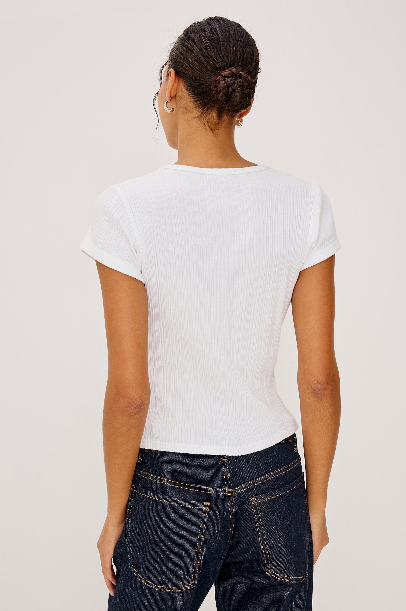 Mickey Fitted Crewneck Short Sleeve Baby Tee With Pointelle Detailing in White Colorway -Upper Body View Featuerd on Model