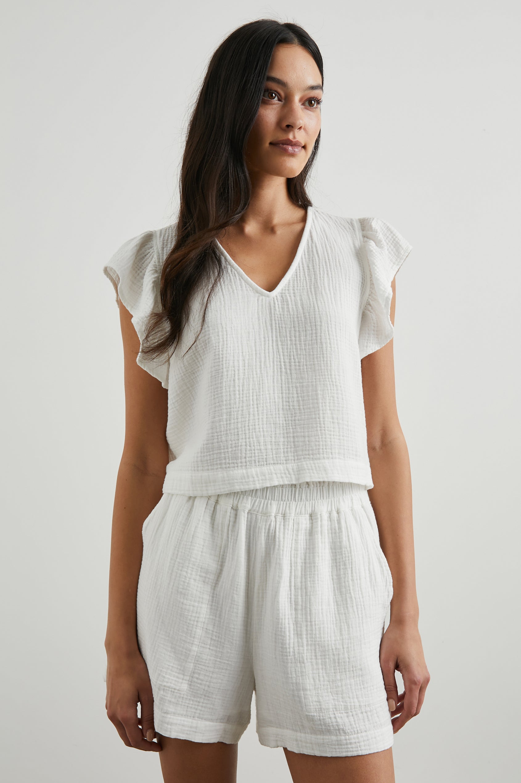 Miley Cropped, Short-Sleeve, V Neck Top with Flutter Sleeves and Textured Fabric in White Colorway - Front View Featured on Model