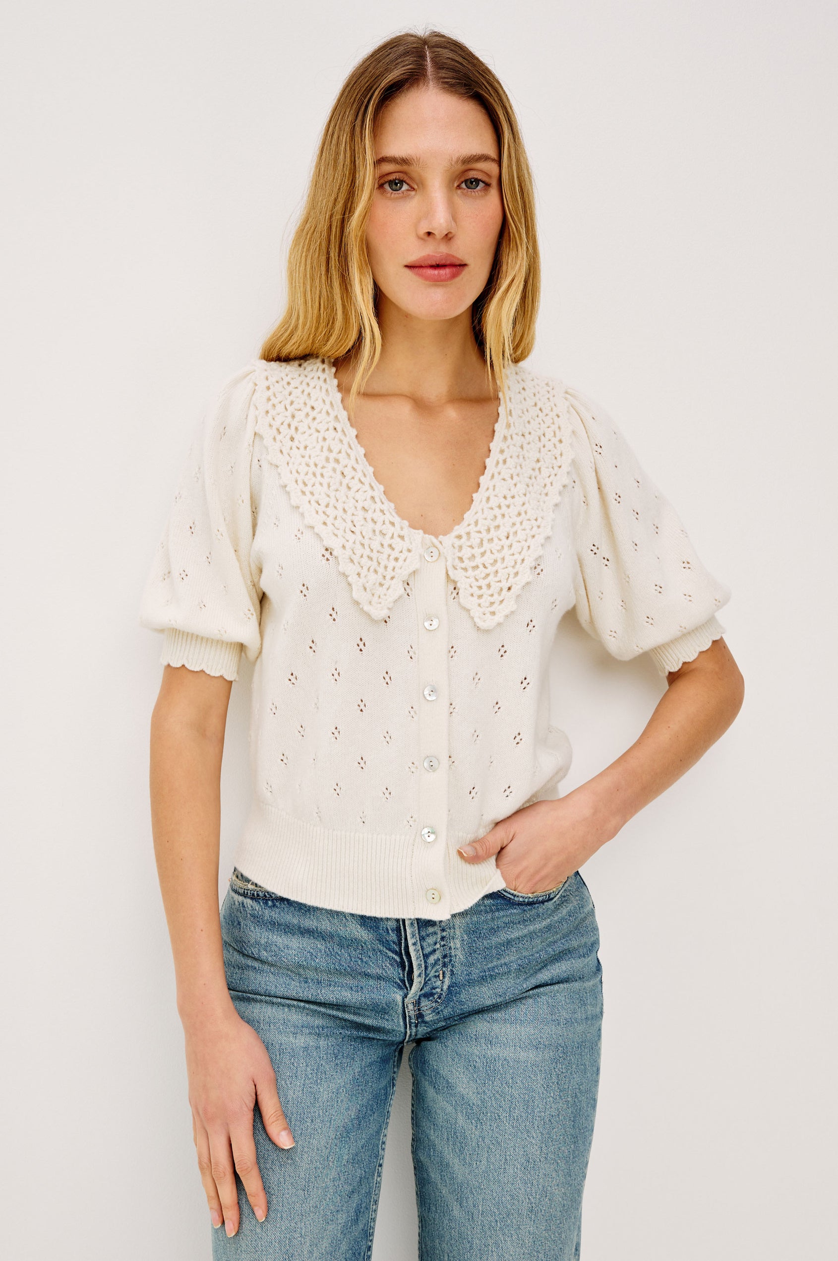 Mindy Cardigan Top in Cotton Wool Blend With Crochet Peter Pan Collar, Short Puff Sleeves, and Ribbed Trim in Ivory Colorway - Upper Body Front View Featured on Model