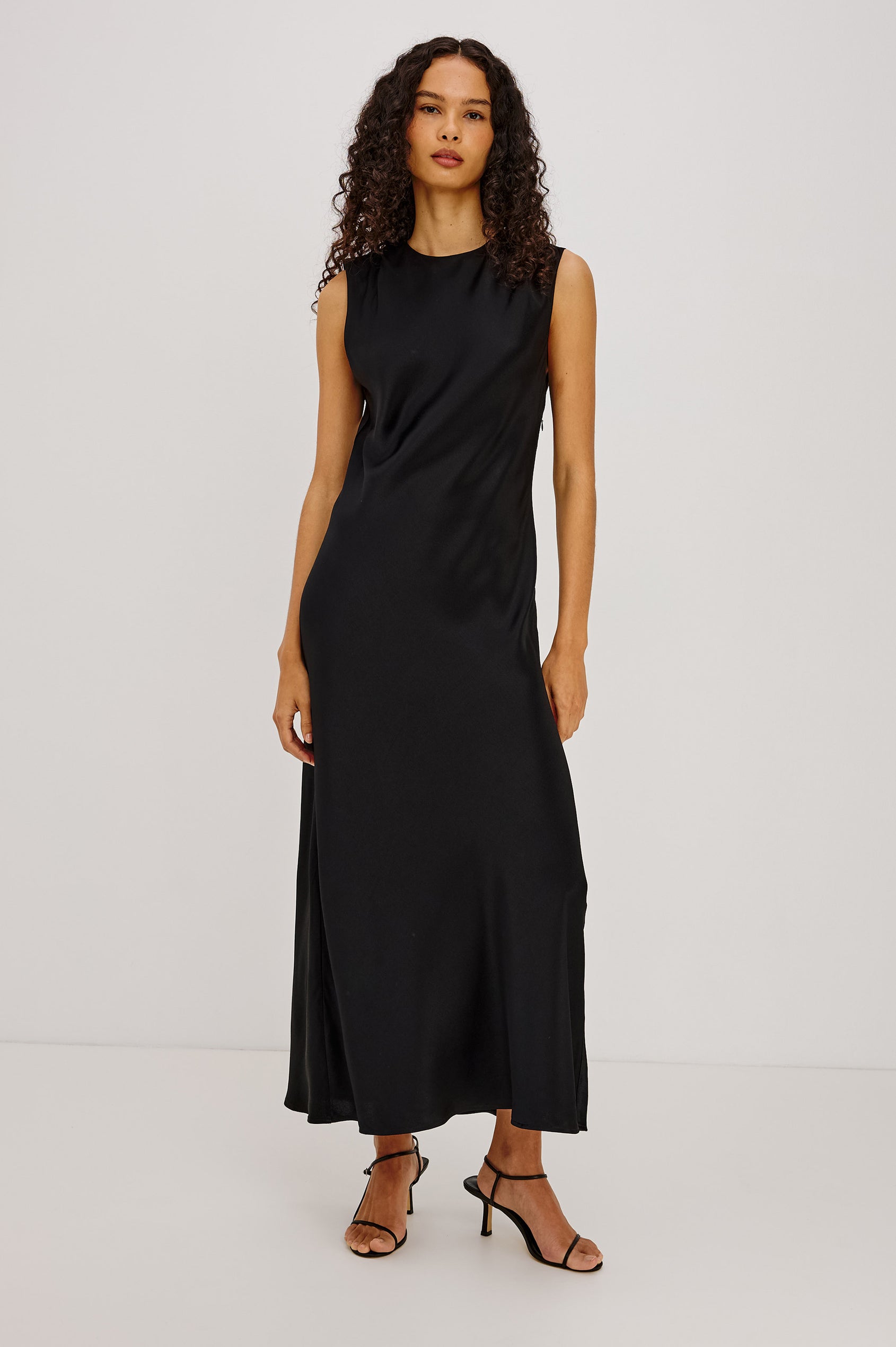 Mira Maxi Dress Bias Cut in Satin-Back Crepe With Crew Neckline, Pleated Shoulders, Side Zipper, and Keyhole Back With Button-Loop Closure in Black Colorway - Full Body Front View Featured on Model