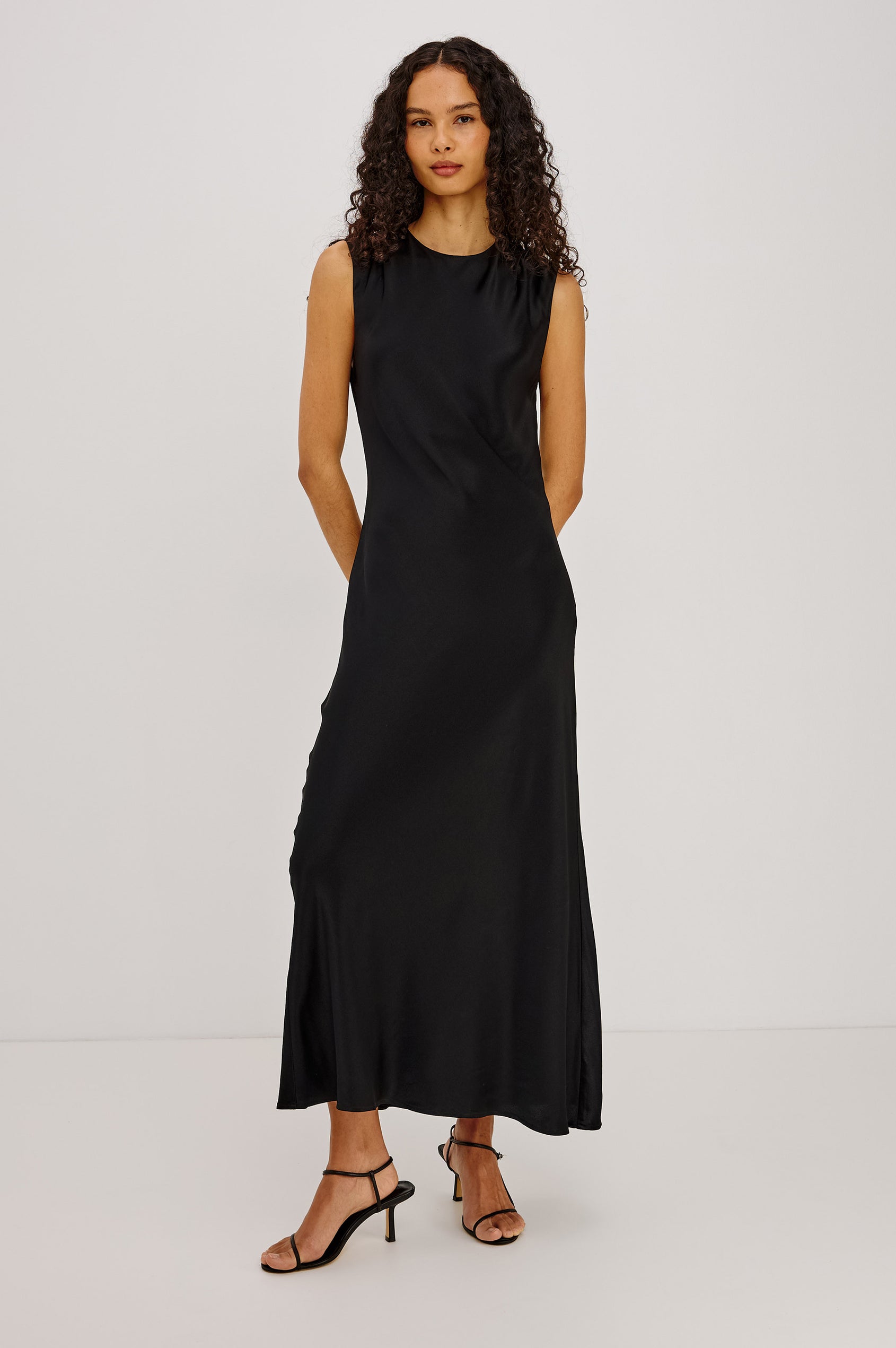 Mira Maxi Dress Bias Cut in Satin-Back Crepe With Crew Neckline, Pleated Shoulders, Side Zipper, and Keyhole Back With Button-Loop Closure in Black Colorway - Full Body Front View Featured on Model