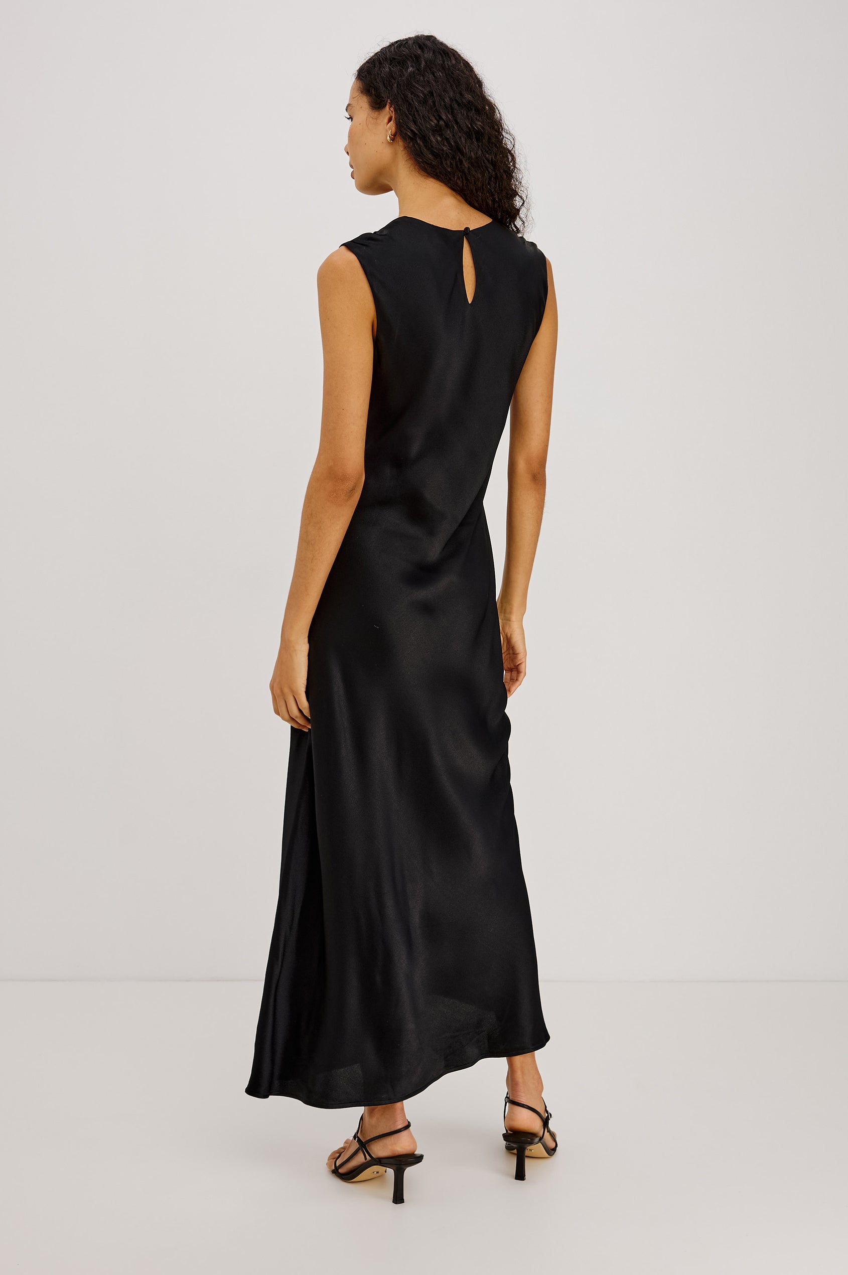 Mira Maxi Dress Bias Cut in Satin-Back Crepe With Crew Neckline, Pleated Shoulders, Side Zipper, and Keyhole Back With Button-Loop Closure in Black Colorway - Full Body Back View Featured on Model