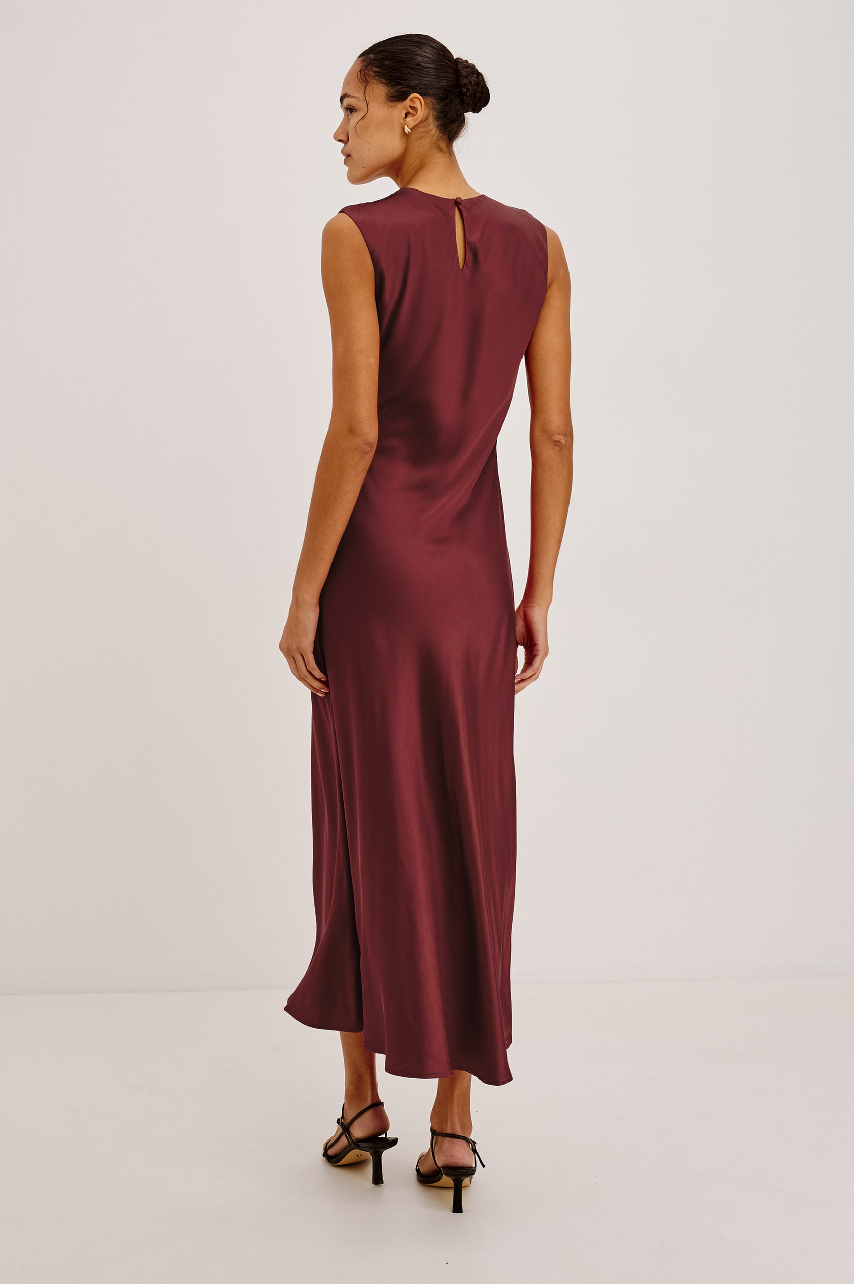Mira Maxi Dress Bias Cut in Satin-Back Crepe With Crew Neckline, Pleated Shoulders, Side Zipper, and Keyhole Back With Button-Loop Closure in Crimson Colorway - Full Body Back View Featured on Model