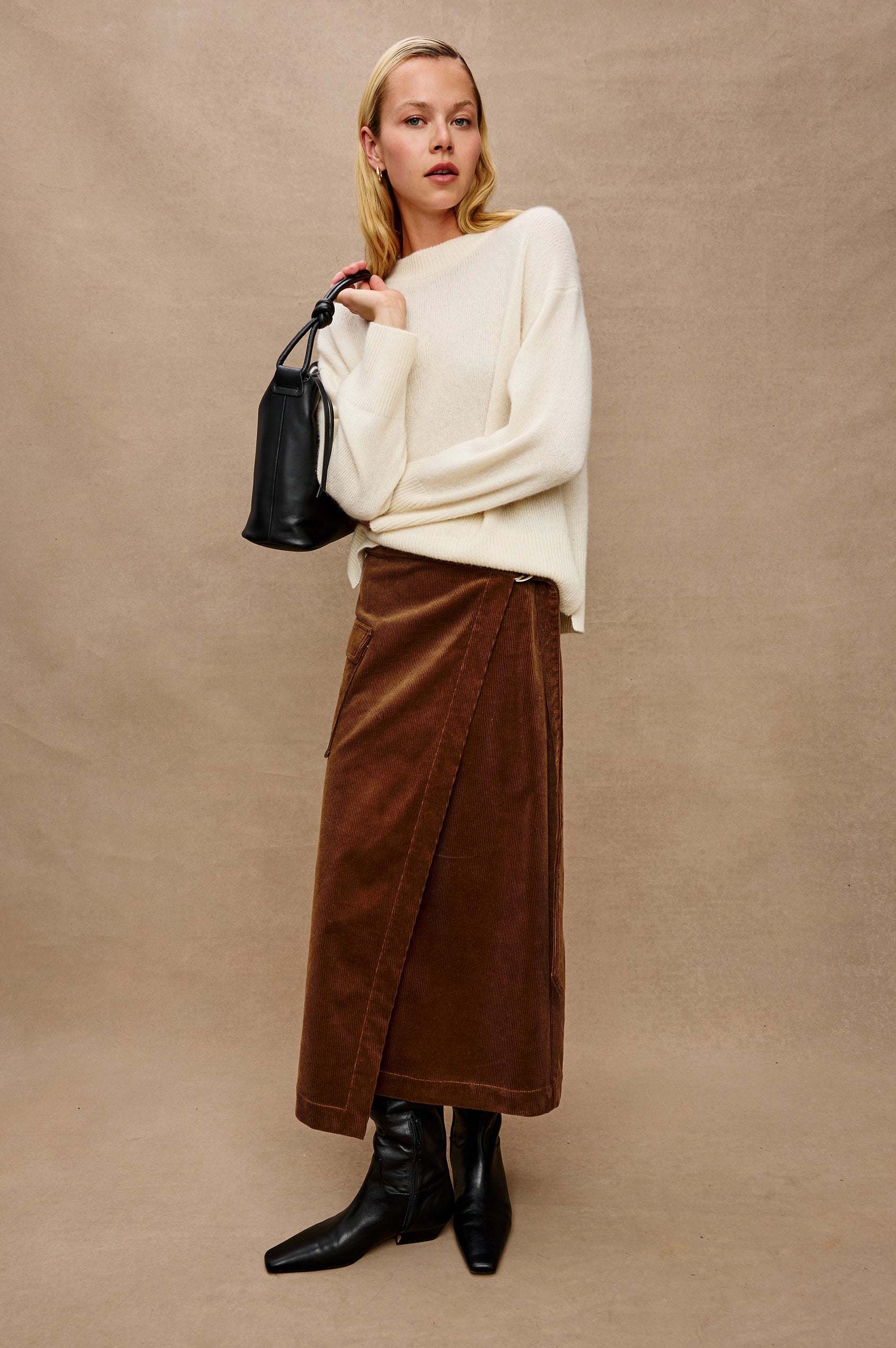 Miranda Long-Sleeve Sweater with a Mock Neck, Side Slits, and Ribbed Trim in Ivory Colorway - Stylized Full Body Front View Featured on Model