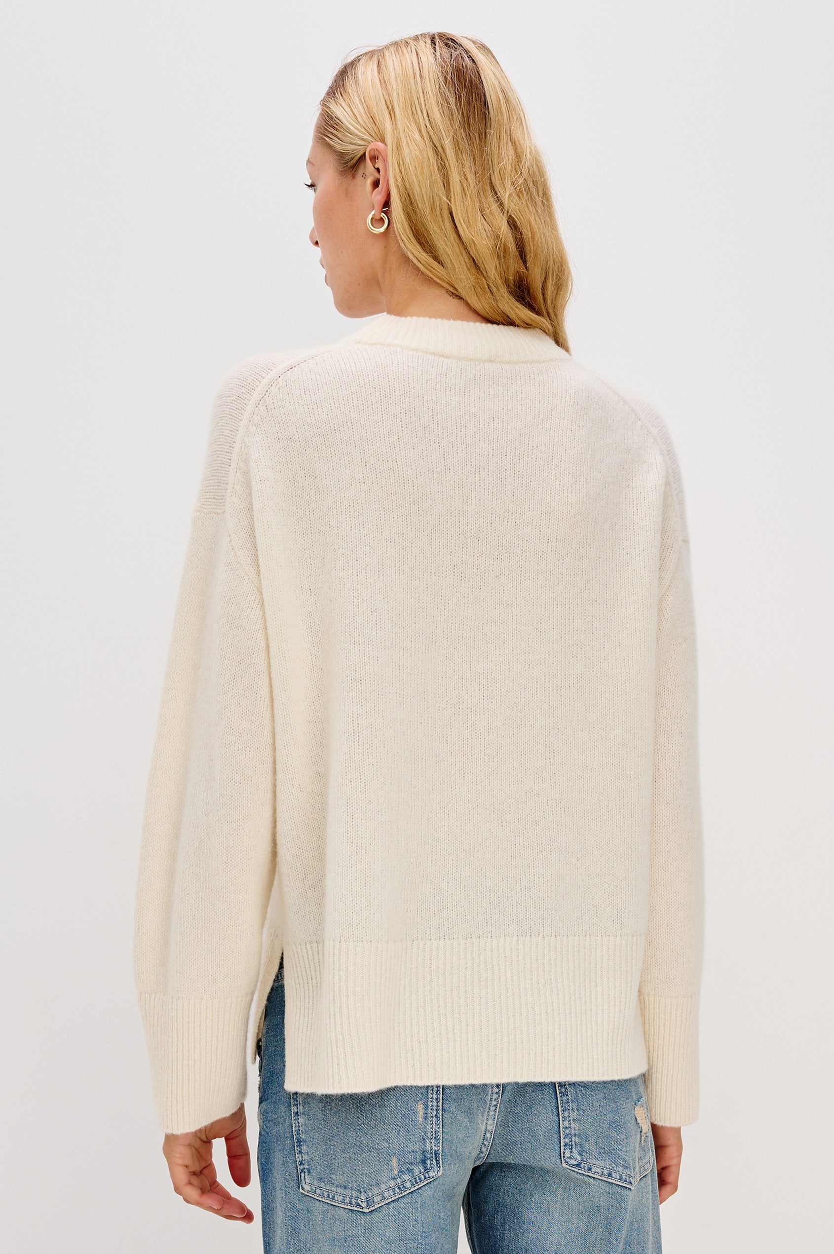 Miranda Long-Sleeve Sweater with a Mock Neck, Side Slits, and Ribbed Trim in Ivory Colorway - Back View Featured on Model