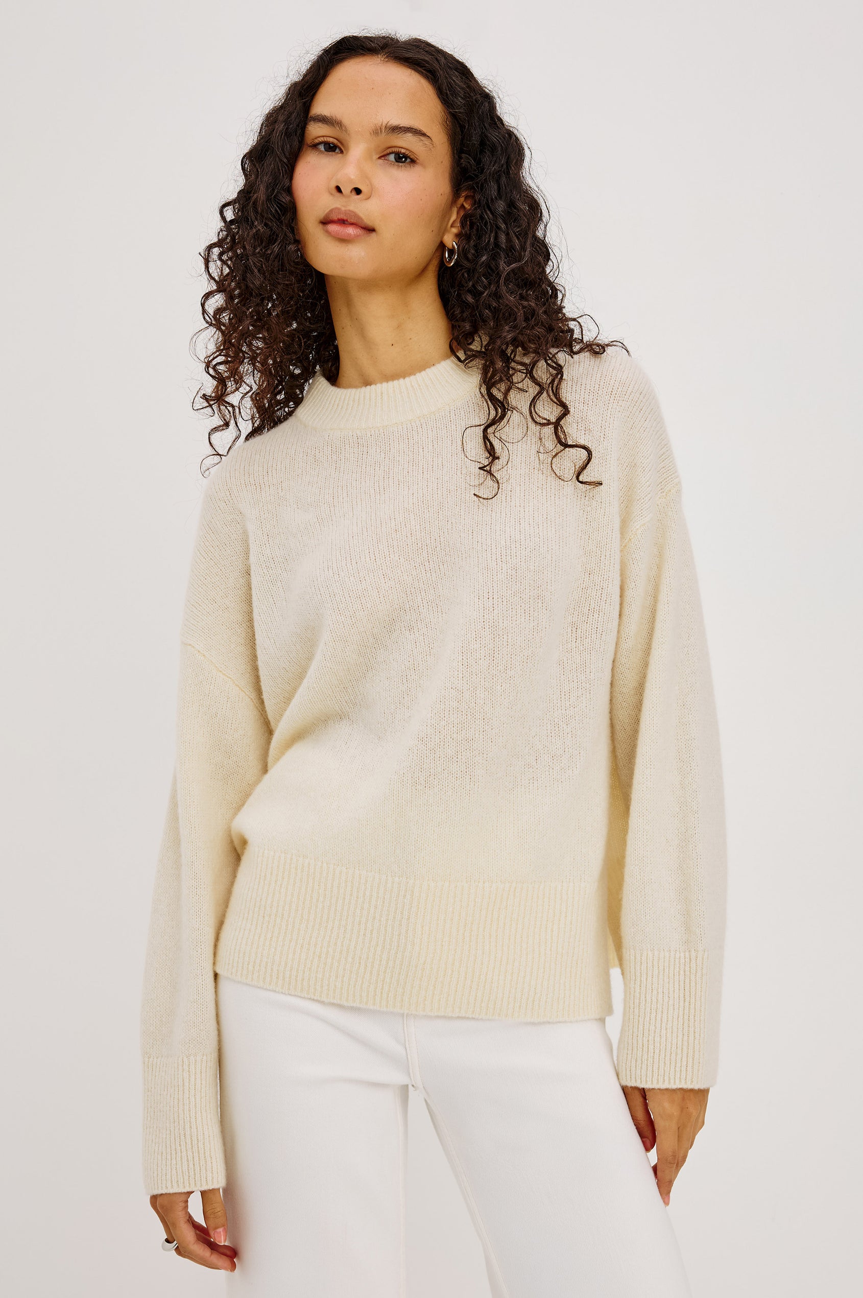 Miranda Sweater in Cashmere-Silk Blend With Relaxed Boxy Fit, Mock Neck, Drop Shoulders, and Side Slits at Hem in Ivory Colorway - Upper Body Front View Featured on Model