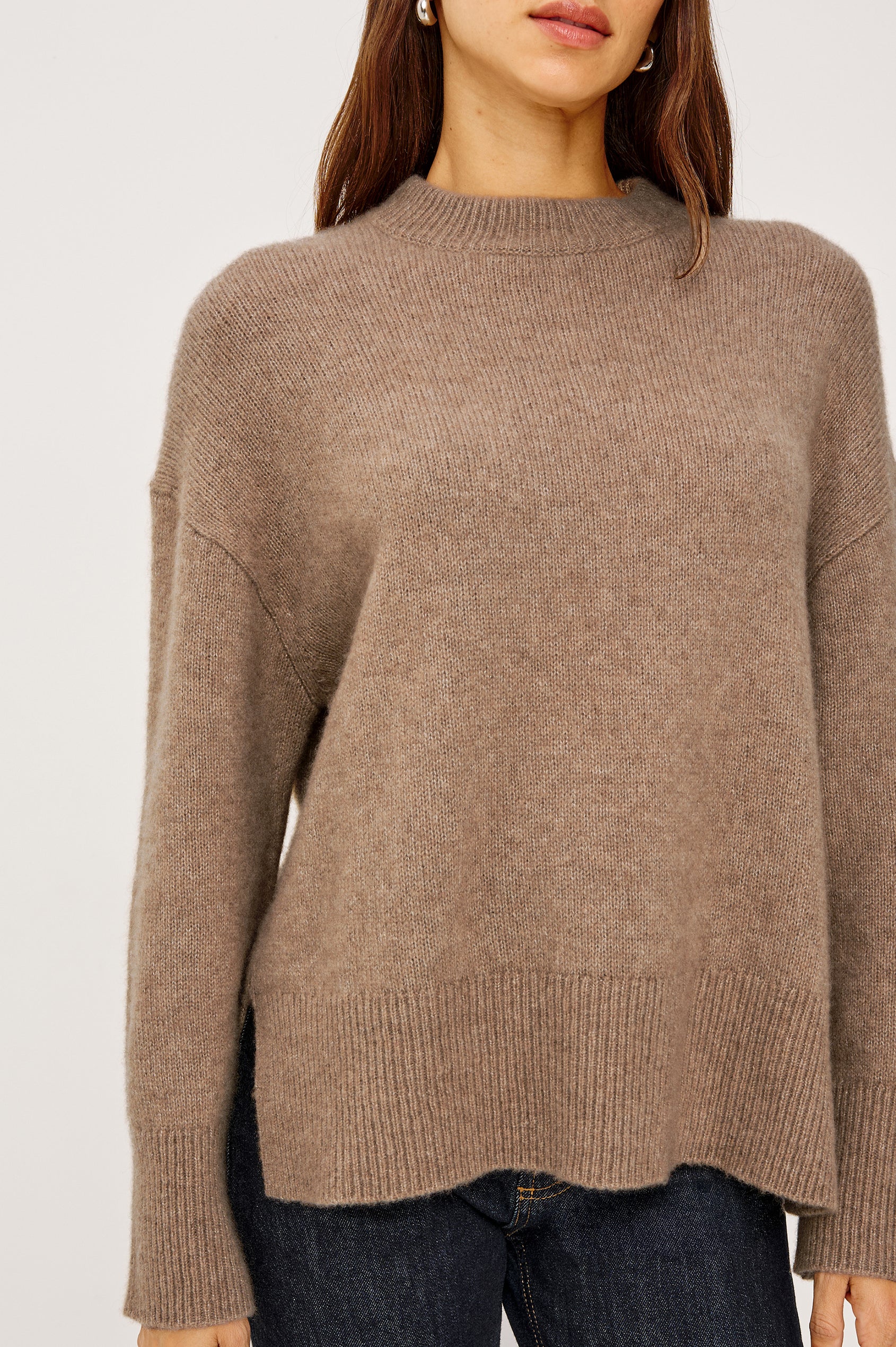 Miranda Long-Sleeve Sweater with a Mock Neck, Side Slits, and Ribbed Trim in Oatmeal Colorway - Close Up View Featured on Model
