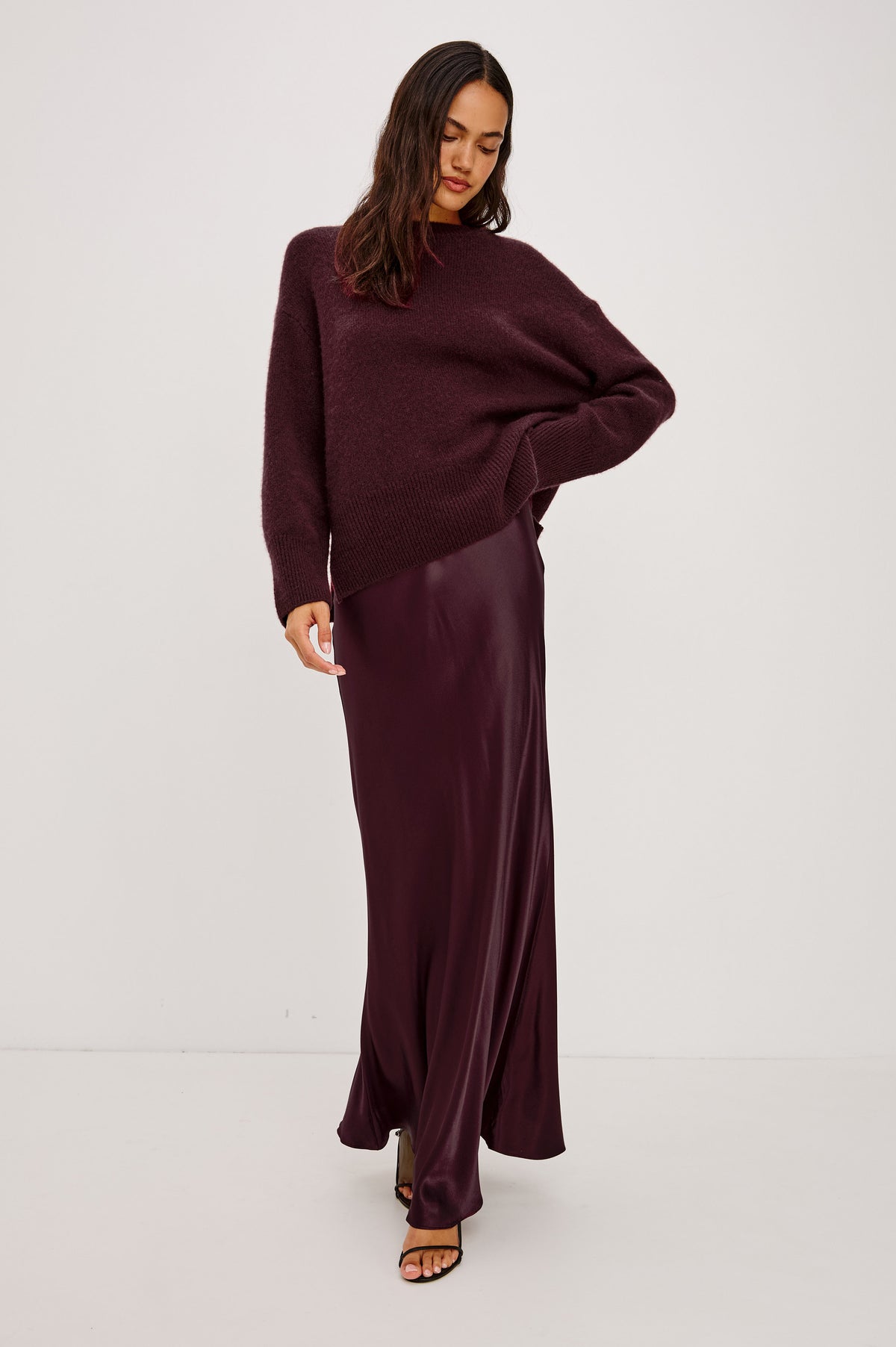 Miranda Sweater in Cashmere-Silk Blend With Relaxed Boxy Fit, Mock Neck, Drop Shoulders, and Side Slits at Hem in Wine Colorway - Front Full Body View Featured on Model