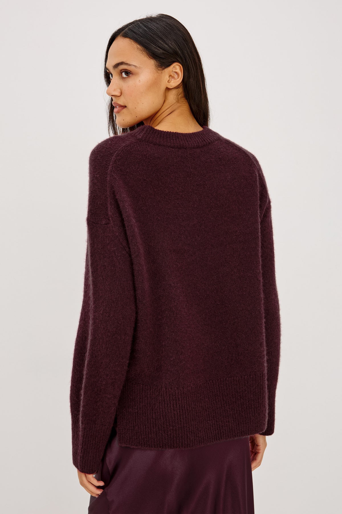 Miranda Sweater in Cashmere-Silk Blend With Relaxed Boxy Fit, Mock Neck, Drop Shoulders, and Side Slits at Hem in Wine Colorway - Back Crop View Featured on Model