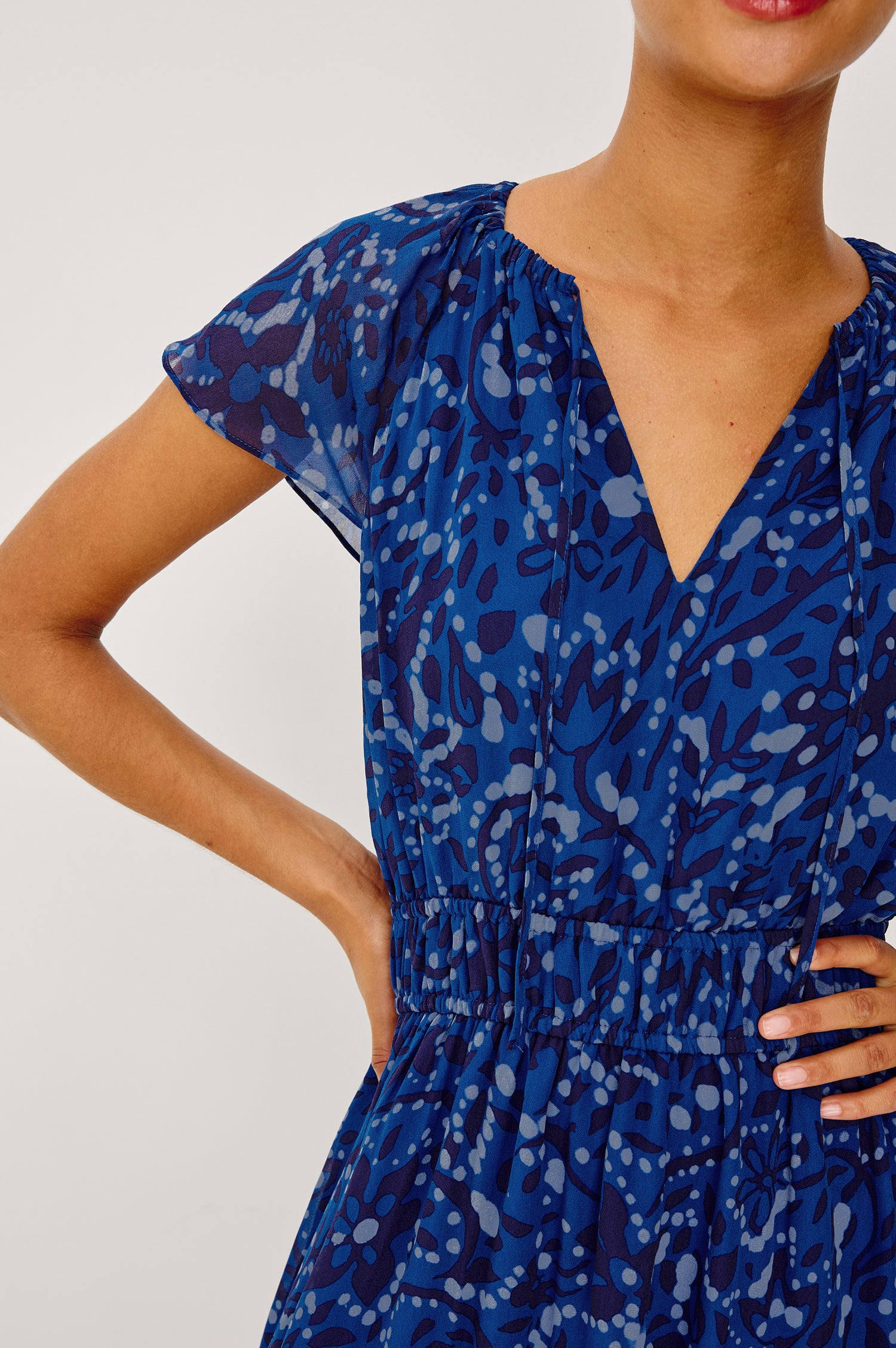 Mirielle Maxi Dress in Chiffon With V-Neckline, Elastic Waist, Center Front Ties, Raglan Short Sleeves, Single Tier Skirt and is Fully Lined - Upper Body Front View Featured on Model