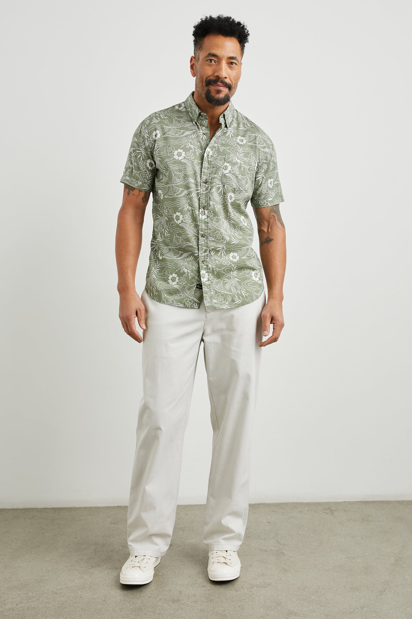 Monaco Short-Sleeve Button Up with a Chest Patch Pocket in Japanese Stencil Fatigue Colorway, a White Floral Print on Fatigue - Front Full Body View Featured on Model
